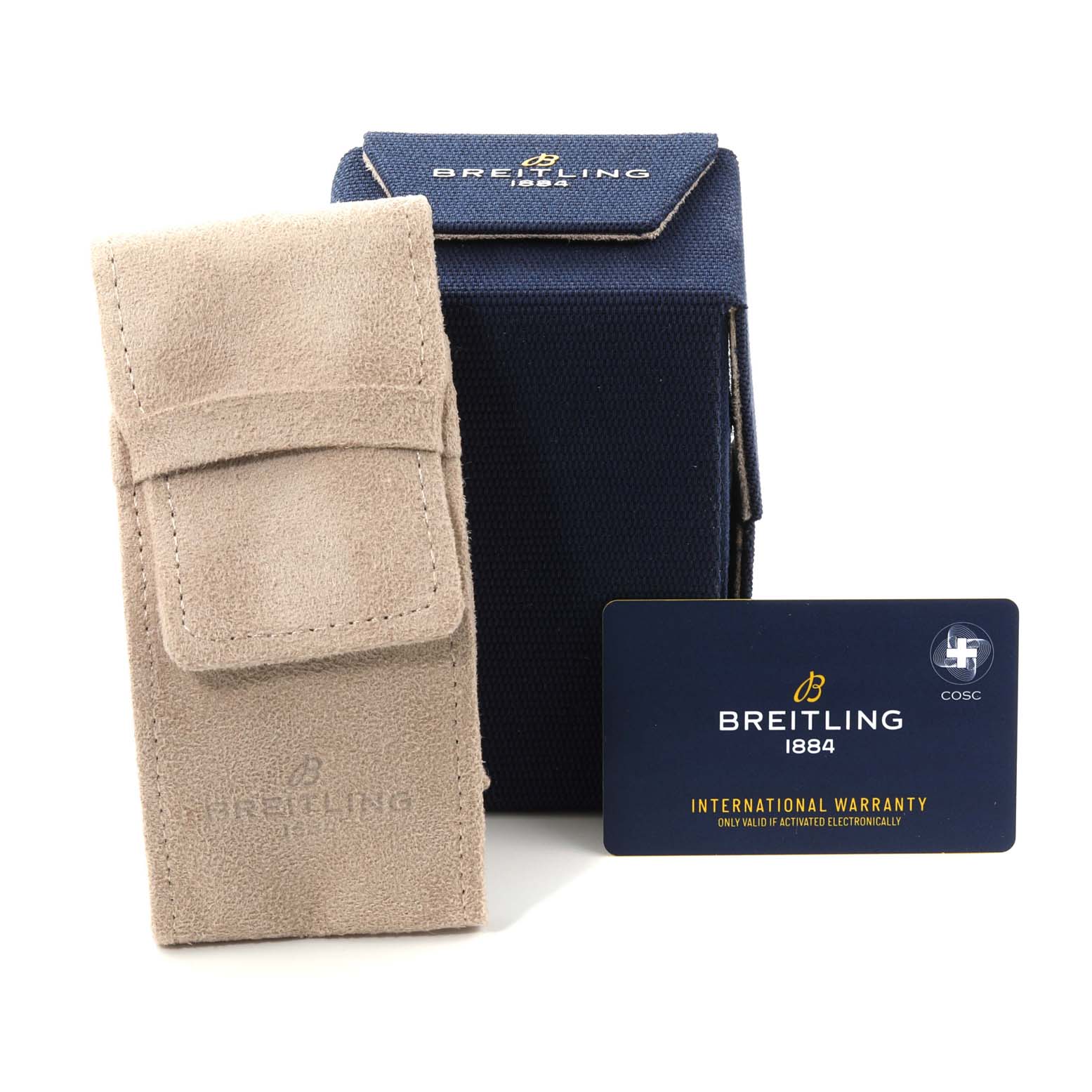 The image shows accessories for a Breitling Navitimer AB0121 Men
s Stainless Steel Blue Dial AB0121 Men
s Stainless Steel Blue Dial watch, including a beige suede case, a blue box, and an international warranty card.