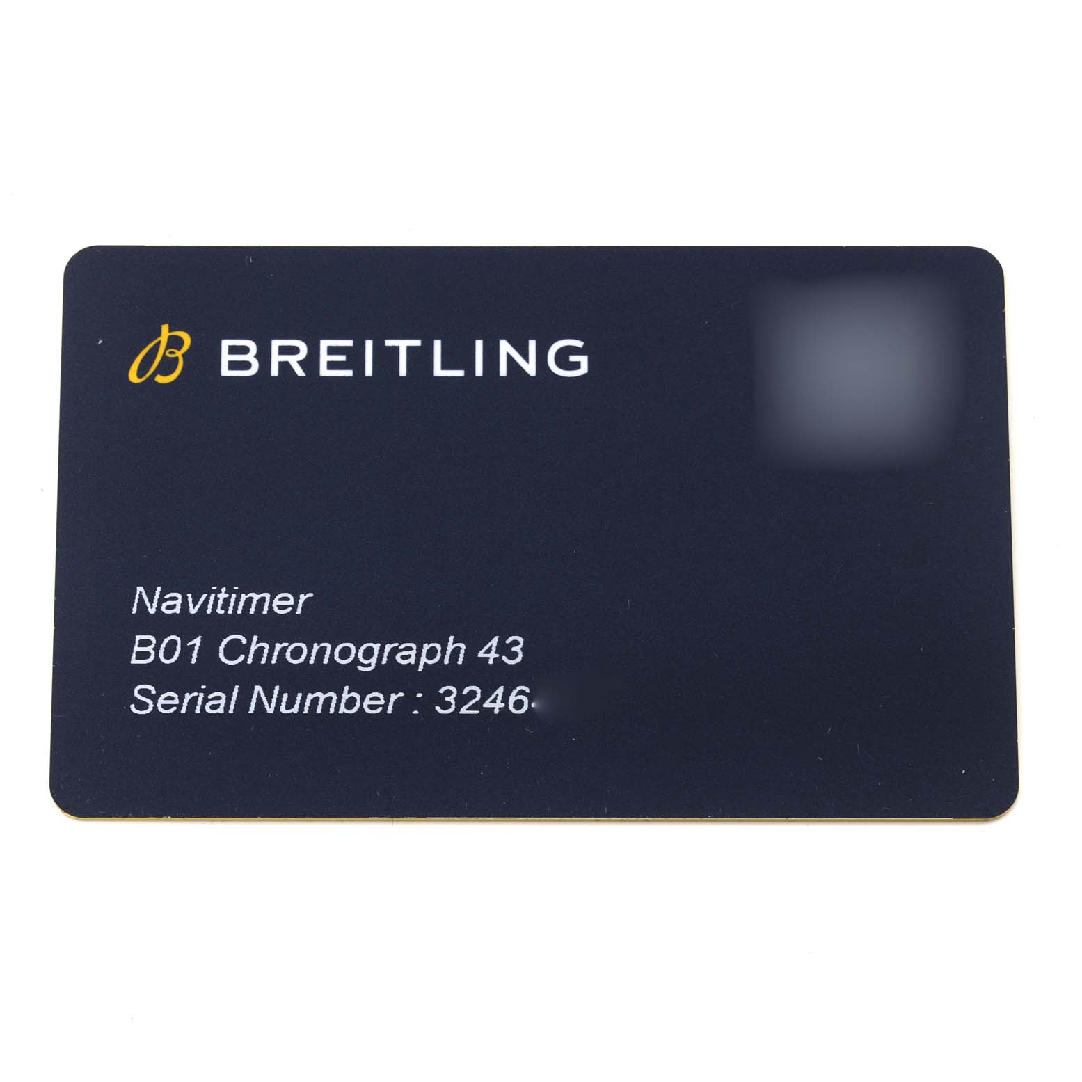 This image shows a close-up of a Breitling Navitimer AB0121 Men
s Stainless Steel Blue Dial AB0121 Men
s Stainless Steel Blue Dial B01 Chronograph 43 warranty card.