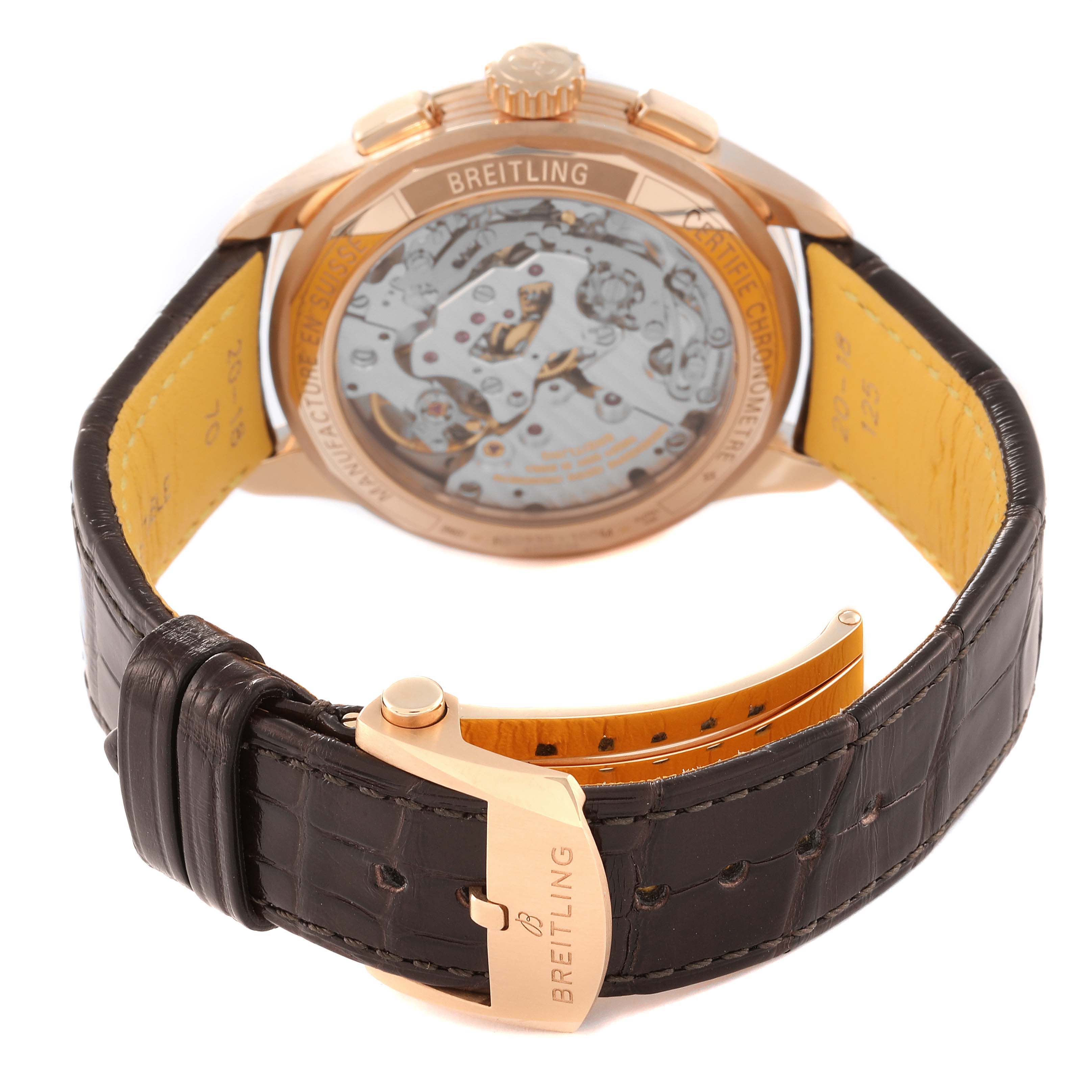 The image shows the back view of a Breitling Premier RB0930 Men's Rose Gold Silver Dial RB0930 Men's Rose Gold Silver Dial watch, highlighting its movement and leather strap with clasp.