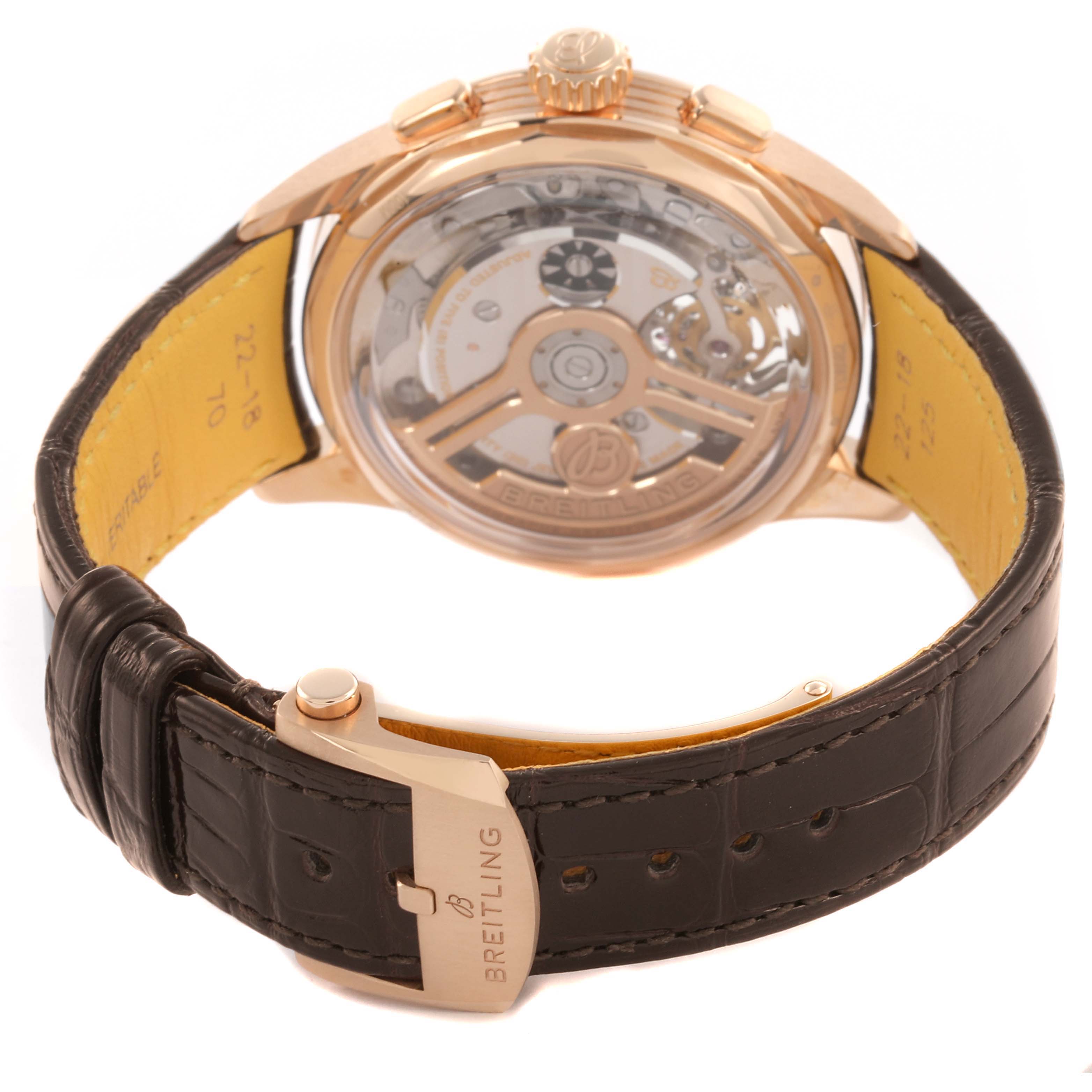 The image shows the back view of the Breitling Premier RB2120 Men's Rose Gold Silver Dial RB2120 Men's Rose Gold Silver Dial watch, highlighting the transparent case back and leather strap.