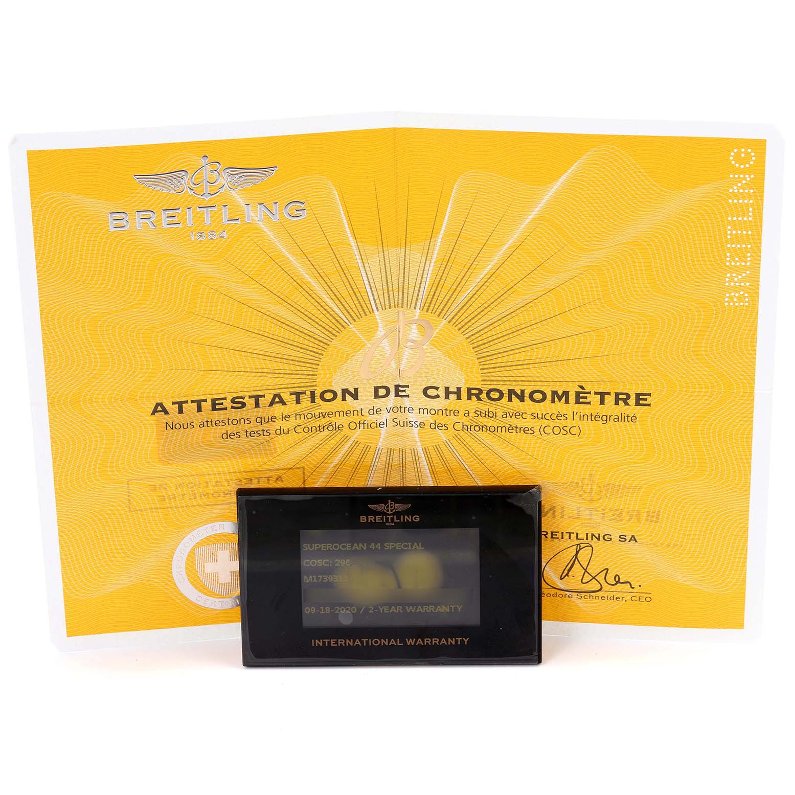 The image shows a Breitling Superocean M17393 Men's Stainless Steel Black Dial M17393 Men's Stainless Steel Black Dial's warranty card and chronometer certificate from a frontal angle.