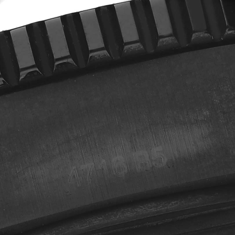 The image shows a close-up of the bezel teeth of a Breitling Superocean M17393 Men's Stainless Steel Black Dial M17393 Men's Stainless Steel Black Dial watch.