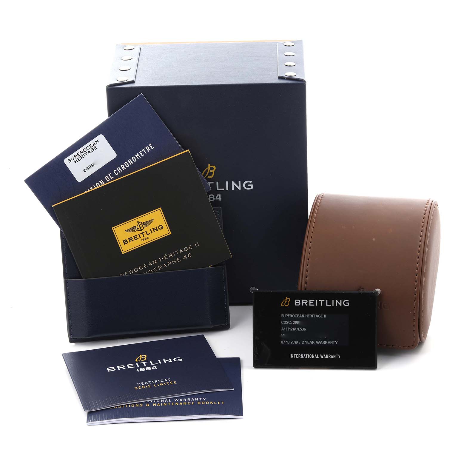 The image shows the packaging and accessories of a Breitling Superocean A13312 Men's Stainless Steel Green Dial A13312 Men's Stainless Steel Green Dial, including manuals, warranty card, box, and case.