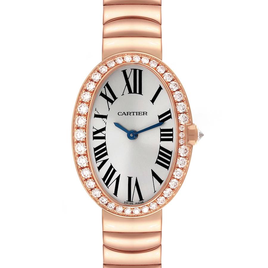 The Cartier Baignoire watch is shown from a top view, highlighting the oval face, diamond bezel, and metal bracelet.