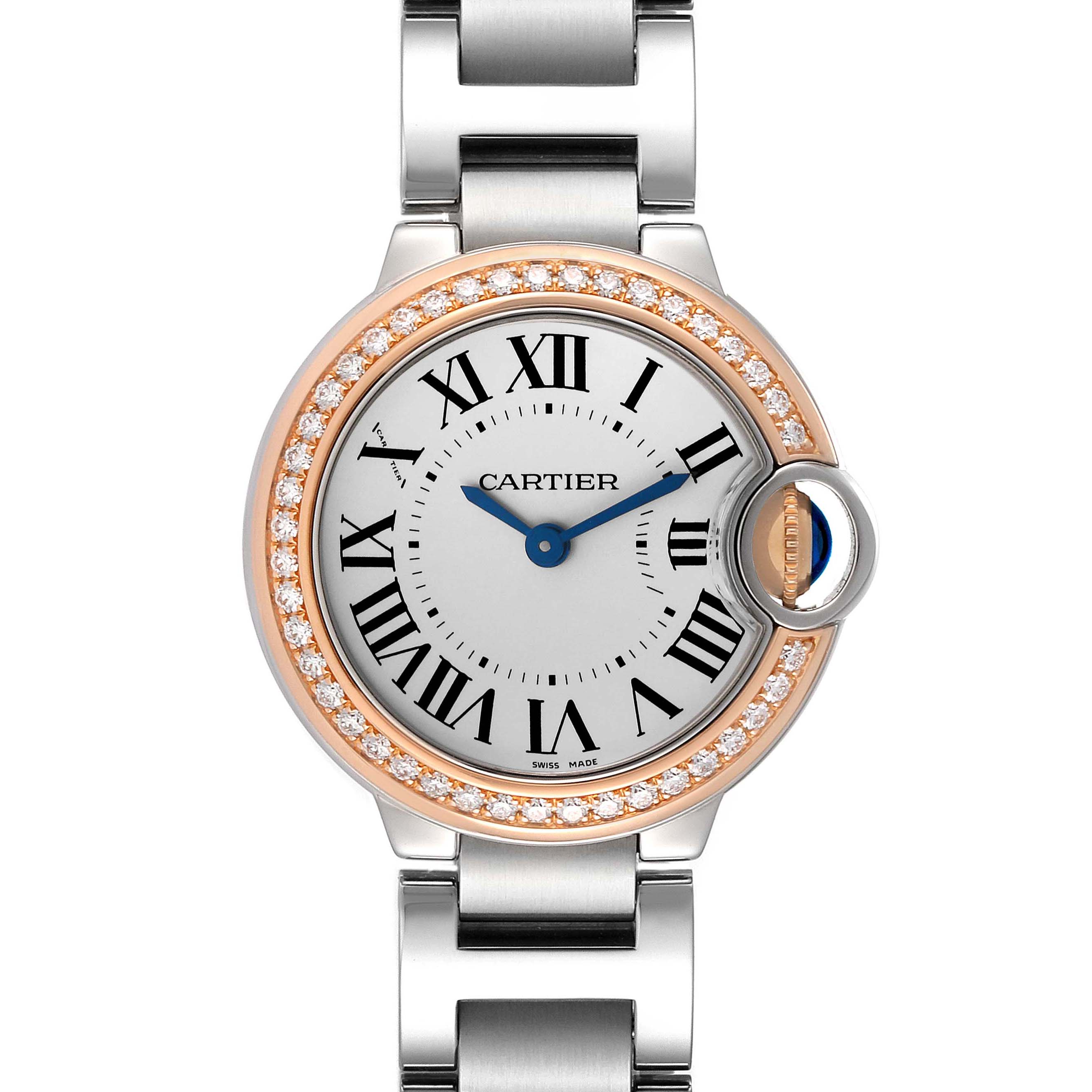 The Cartier Ballon Bleu WE902079 Women's Steel and Gold (two tone) Silver Dial watch is shown from the front, featuring its round face, Roman numerals, diamond bezel, and metal bracelet.