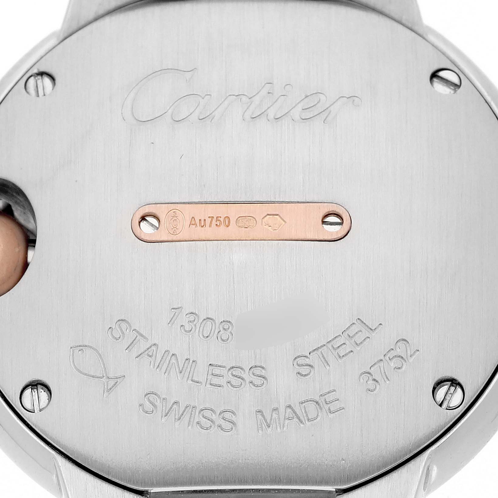 The image shows the back of the Ballon Bleu by Cartier, highlighting the engraved details and metal markings.