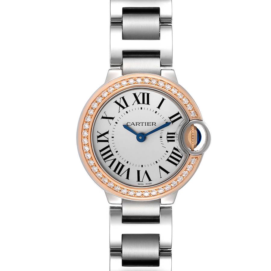 The Cartier Ballon Bleu watch is shown from a top-down angle, highlighting its dial, diamond bezel, and part of the bracelet.