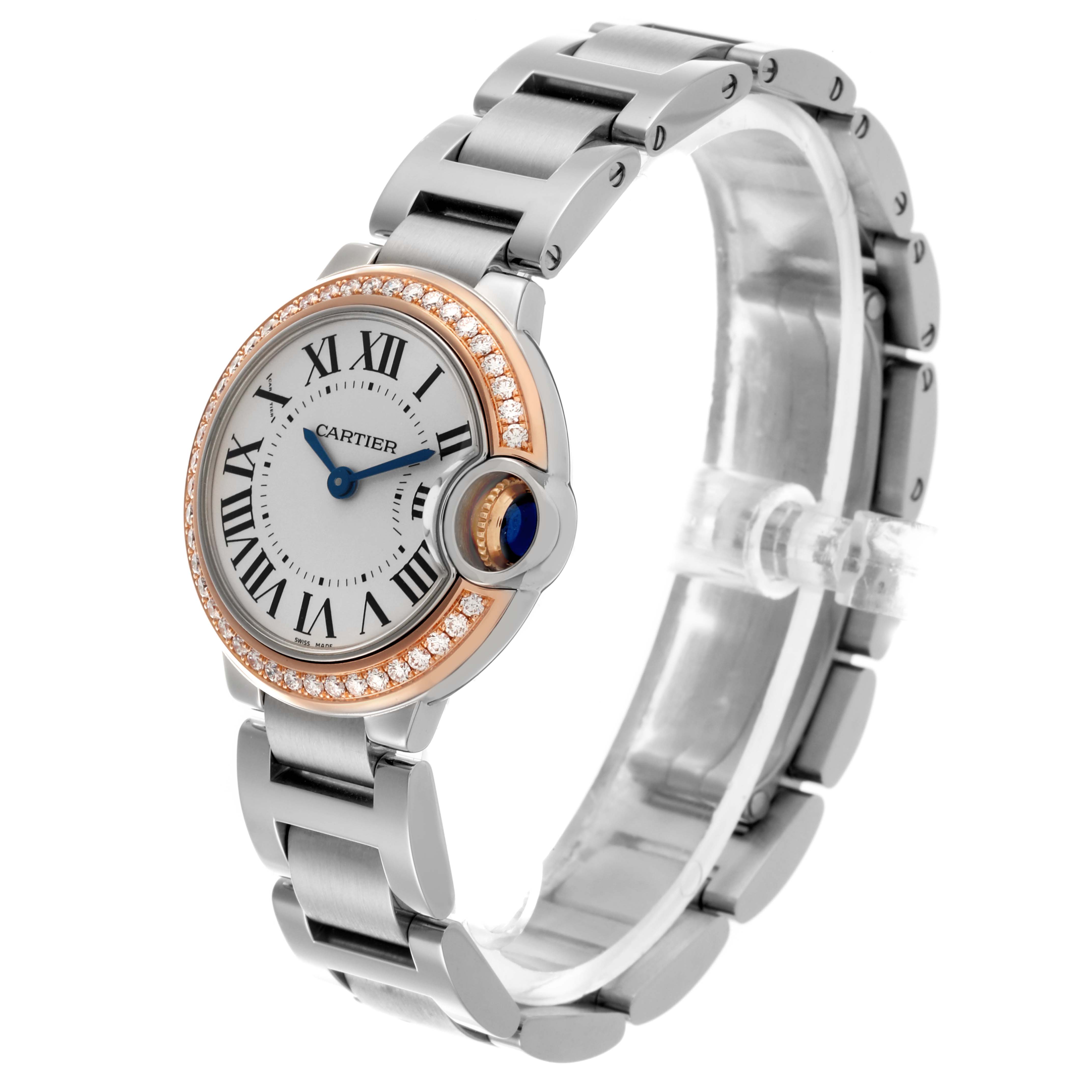 The Cartier Ballon Bleu WE902079 Women's Steel and Gold (two tone) Silver Dial WE902079 Women's Steel and Gold (two tone) Silver Dial watch is shown at an angled view, highlighting its face, bezel, and metal bracelet.