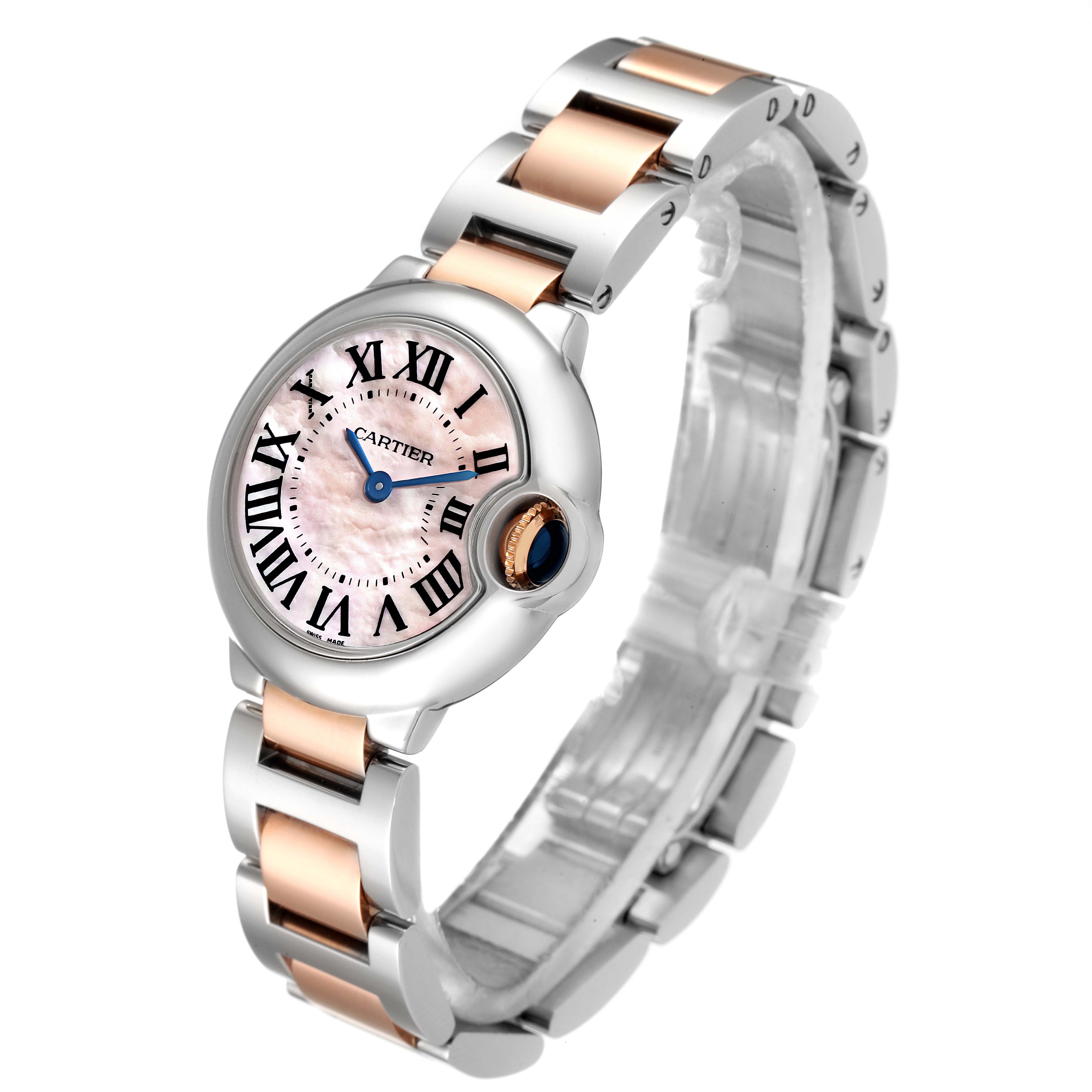 This image shows a side angle view of a Cartier Ballon Bleu W6920034 Women
s Steel and Gold (two tone) Mother of Pearl Dial W6920034 Women
s Steel and Gold (two tone) Mother of Pearl Dial watch, highlighting the face, bracelet, and crown.