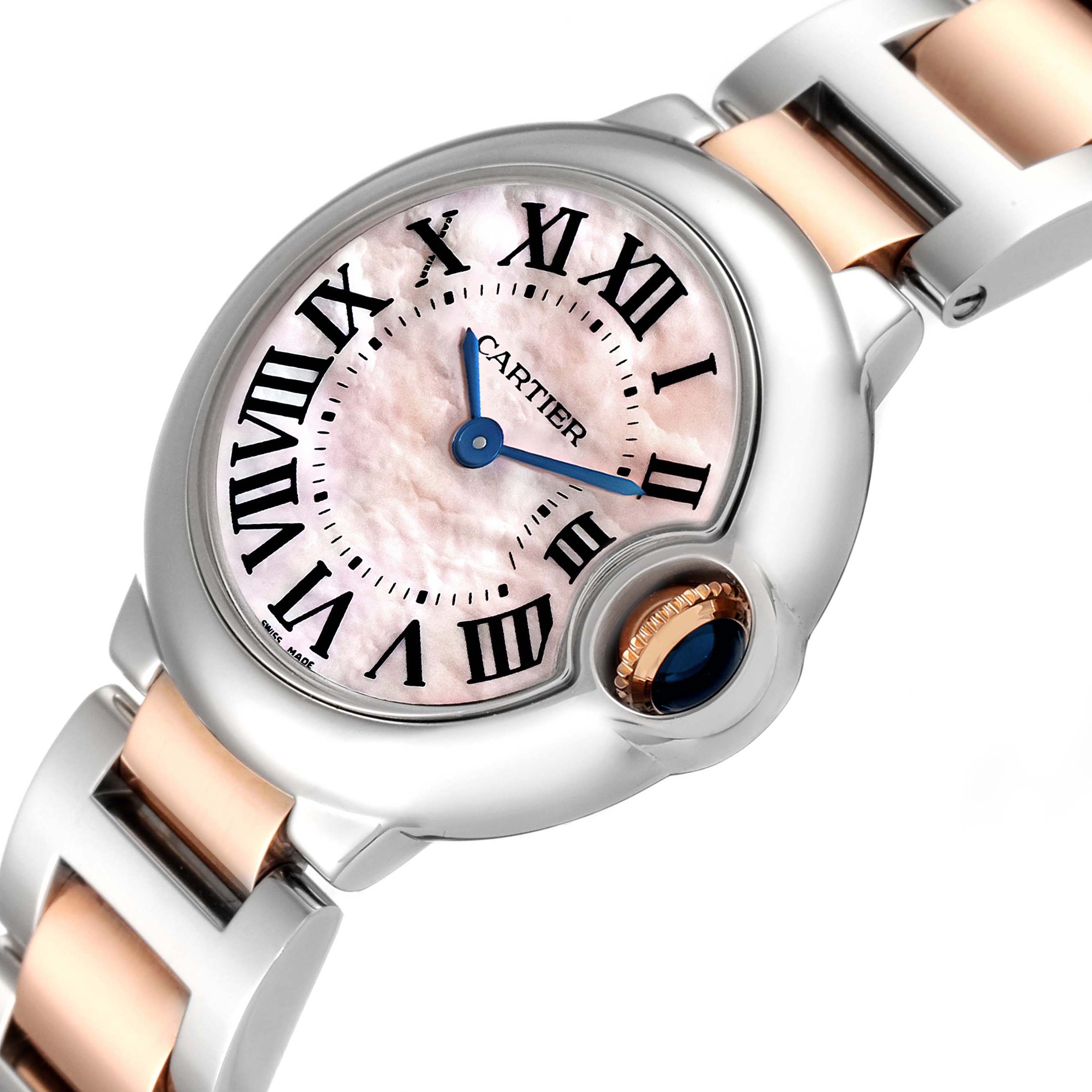 The Cartier Ballon Bleu W6920034 Women
s Steel and Gold (two tone) Mother of Pearl Dial W6920034 Women
s Steel and Gold (two tone) Mother of Pearl Dial watch is shown at a slight angle, highlighting the dial, crown, and part of the bracelet.