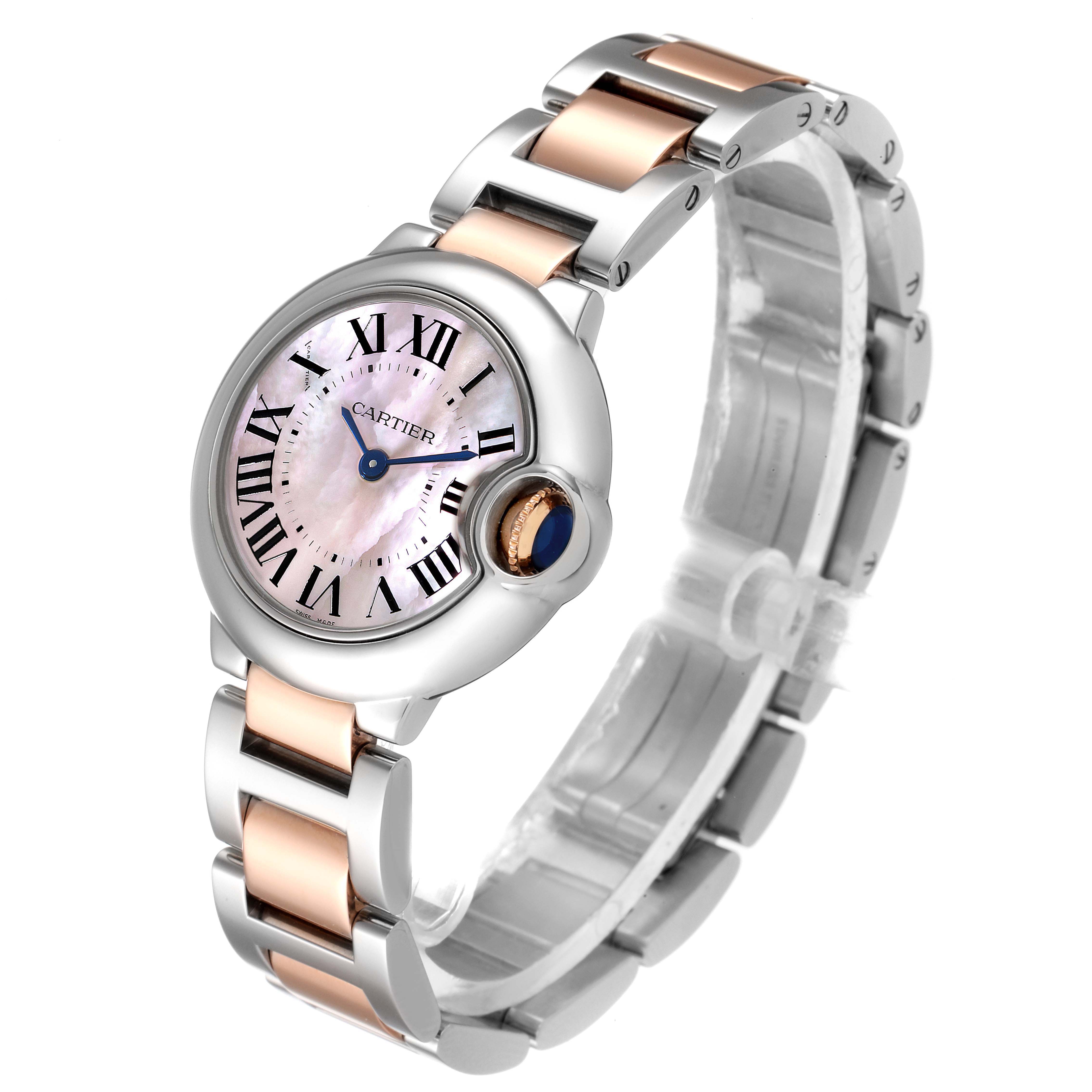 The image shows a Cartier Ballon Bleu W6920034 Women's Steel and Gold (two tone) Mother of Pearl Dial W6920034 Women's Steel and Gold (two tone) Mother of Pearl Dial watch at a three-quarter angle, highlighting its dial, bezel, and bracelet.