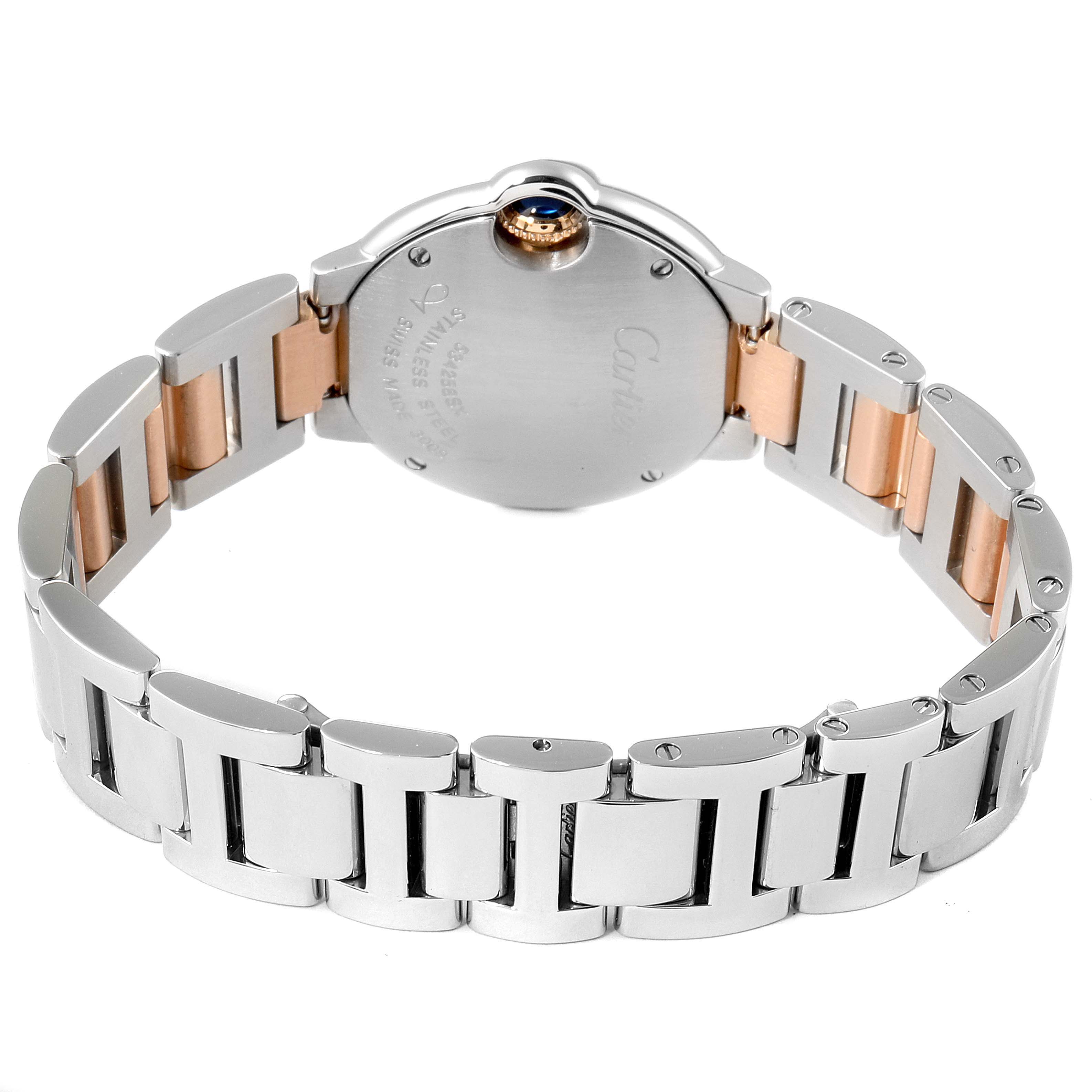 The image shows the back and bracelet of a Ballon Bleu de Cartier watch, highlighting the metal links and case back.