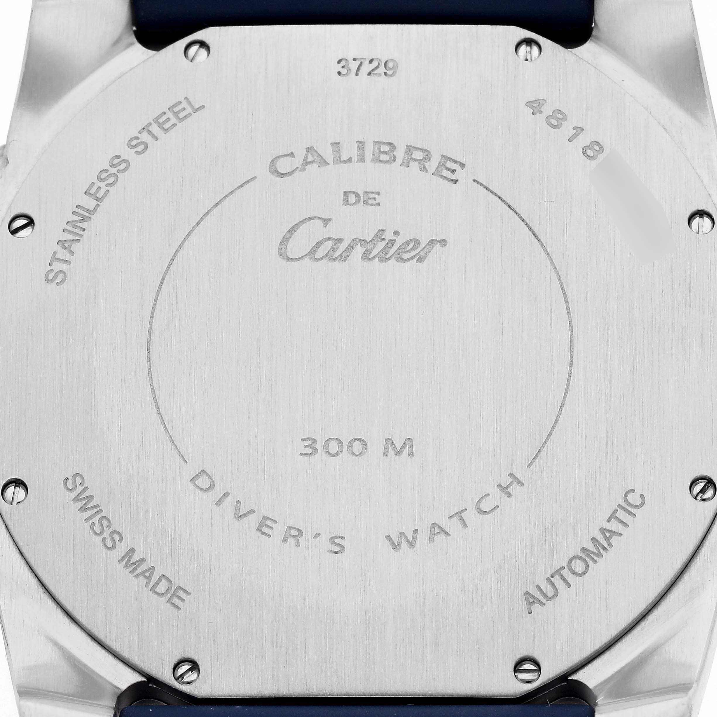 The image shows the back case of the Calibre de Cartier watch, highlighting its stainless steel material and water resistance.