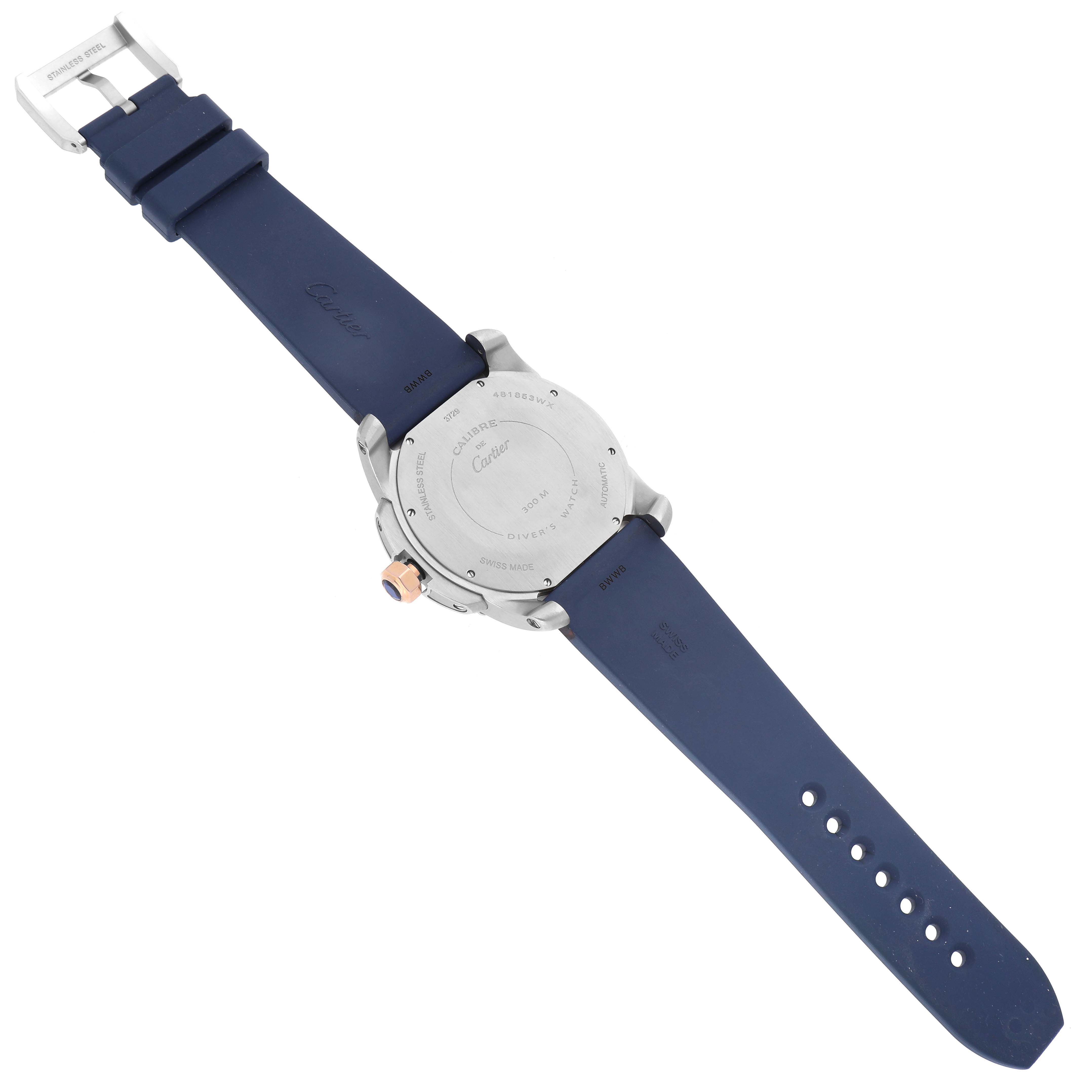 The image shows the back view of a Calibre de Cartier watch, highlighting the case back and blue strap.