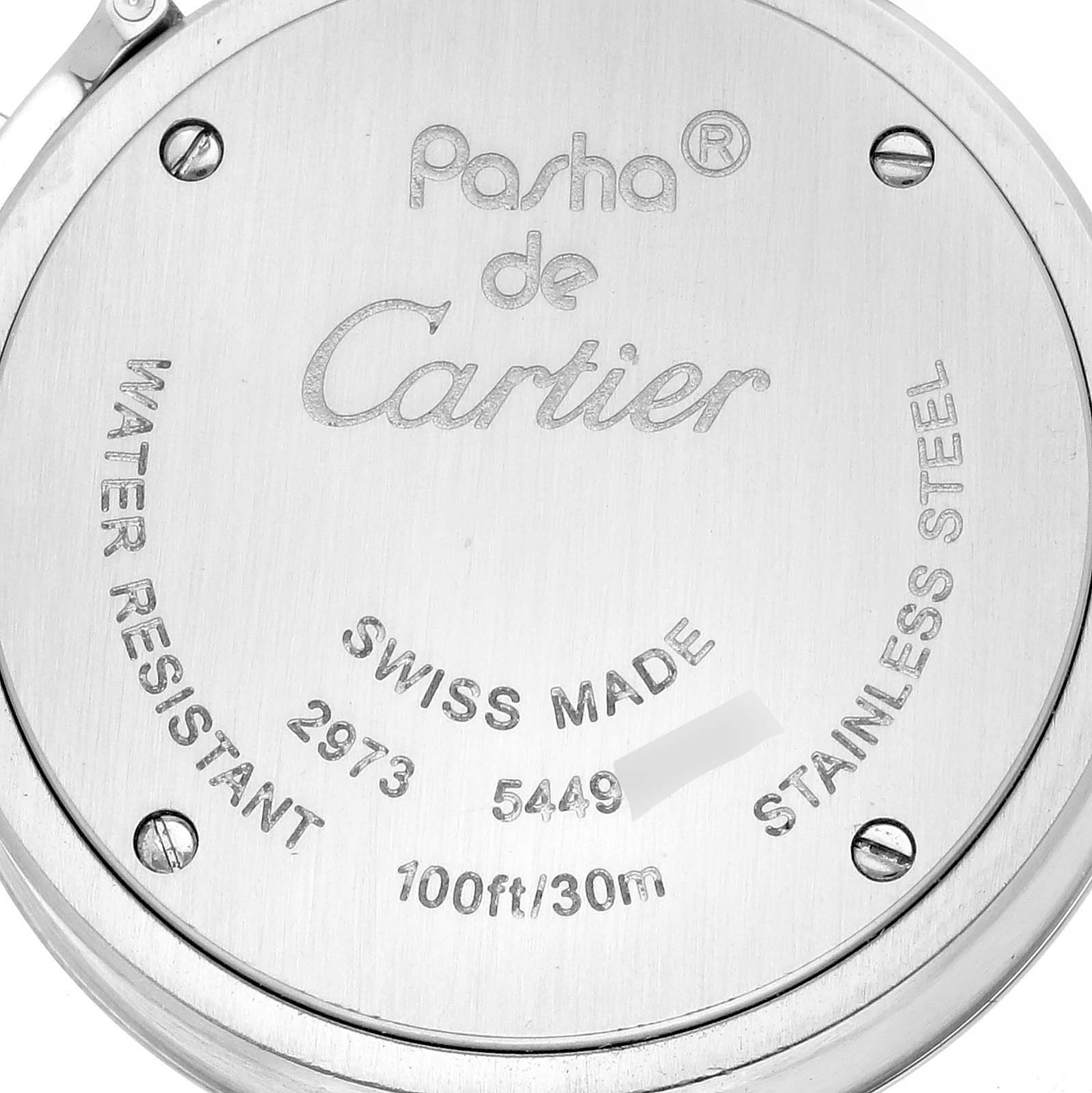 The image shows the case back of a Cartier Pasha W3140023 Women
s Stainless Steel Pink Dial W3140023 Women
s Stainless Steel Pink Dial watch with engravings detailing specifications and branding.