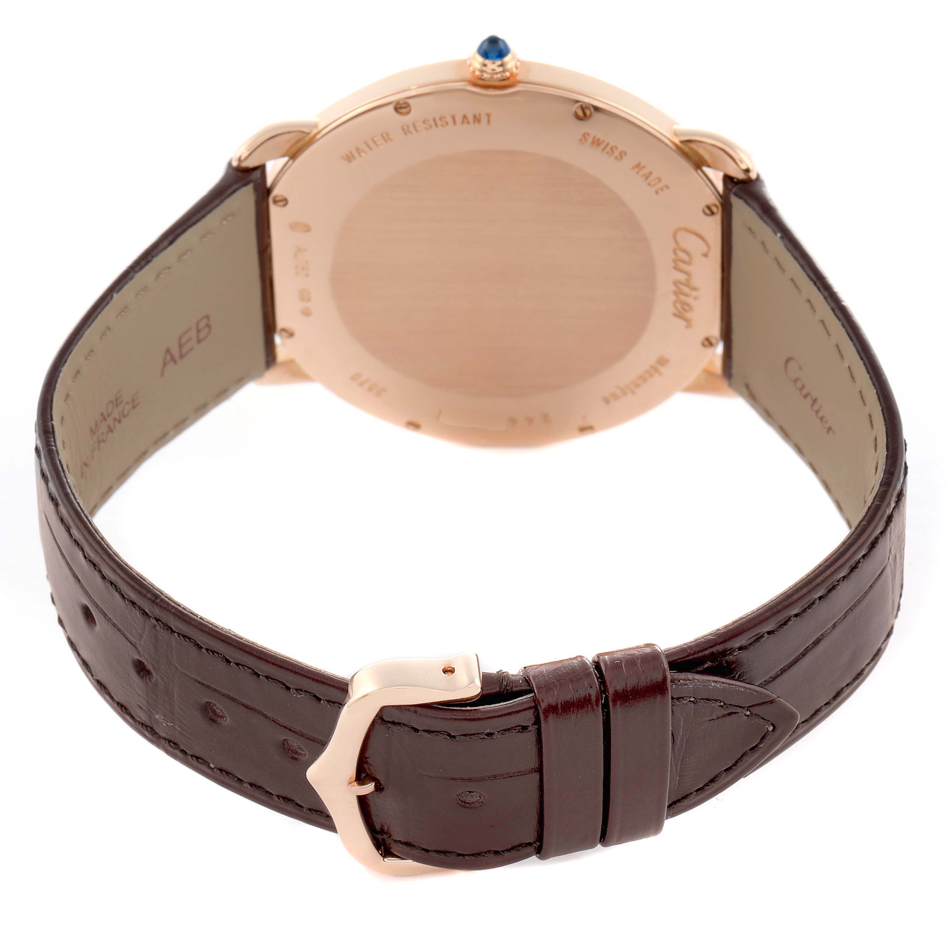 The image shows the back view of a Cartier Ronde W6801004 Men's Rose Gold Silver Dial watch, highlighting the case back, leather strap, and buckle.