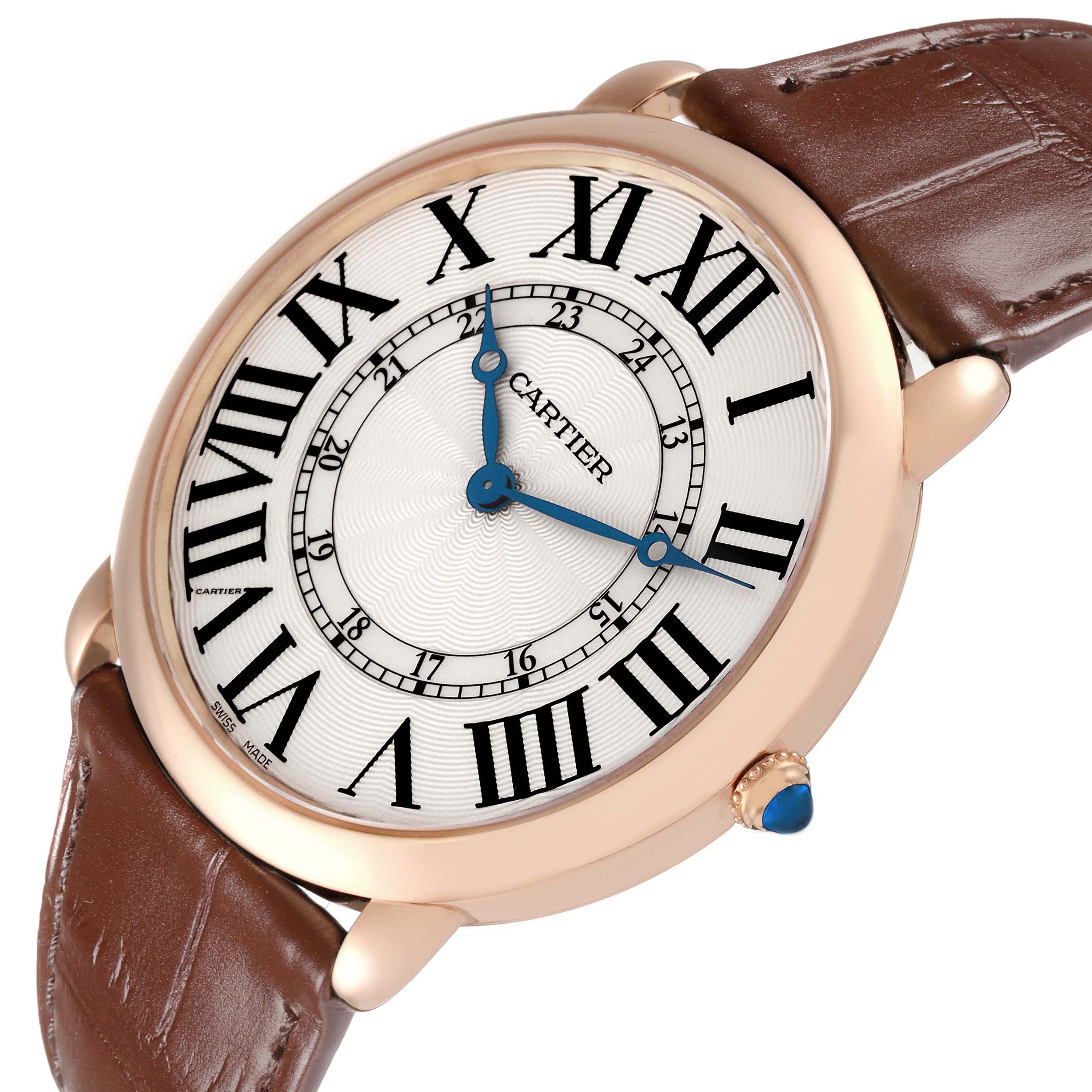 The Cartier Ronde W6801004 Men's Rose Gold Silver Dial watch is shown at an angled view, highlighting the dial, Roman numerals, and brown leather strap.