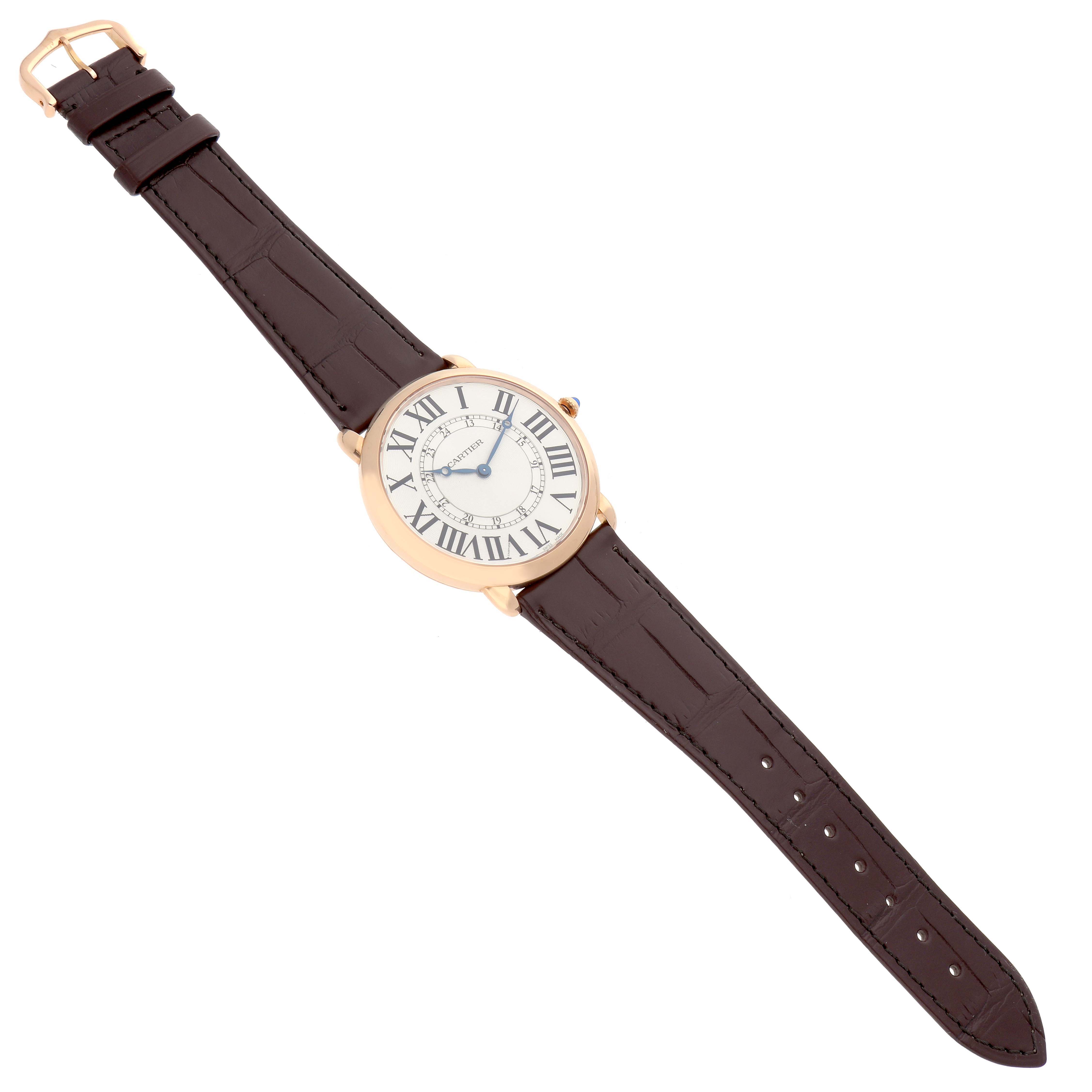 The Cartier Ronde W6801004 Men's Rose Gold Silver Dial watch is shown at a slight diagonal from above, displaying the face, case, and leather strap.