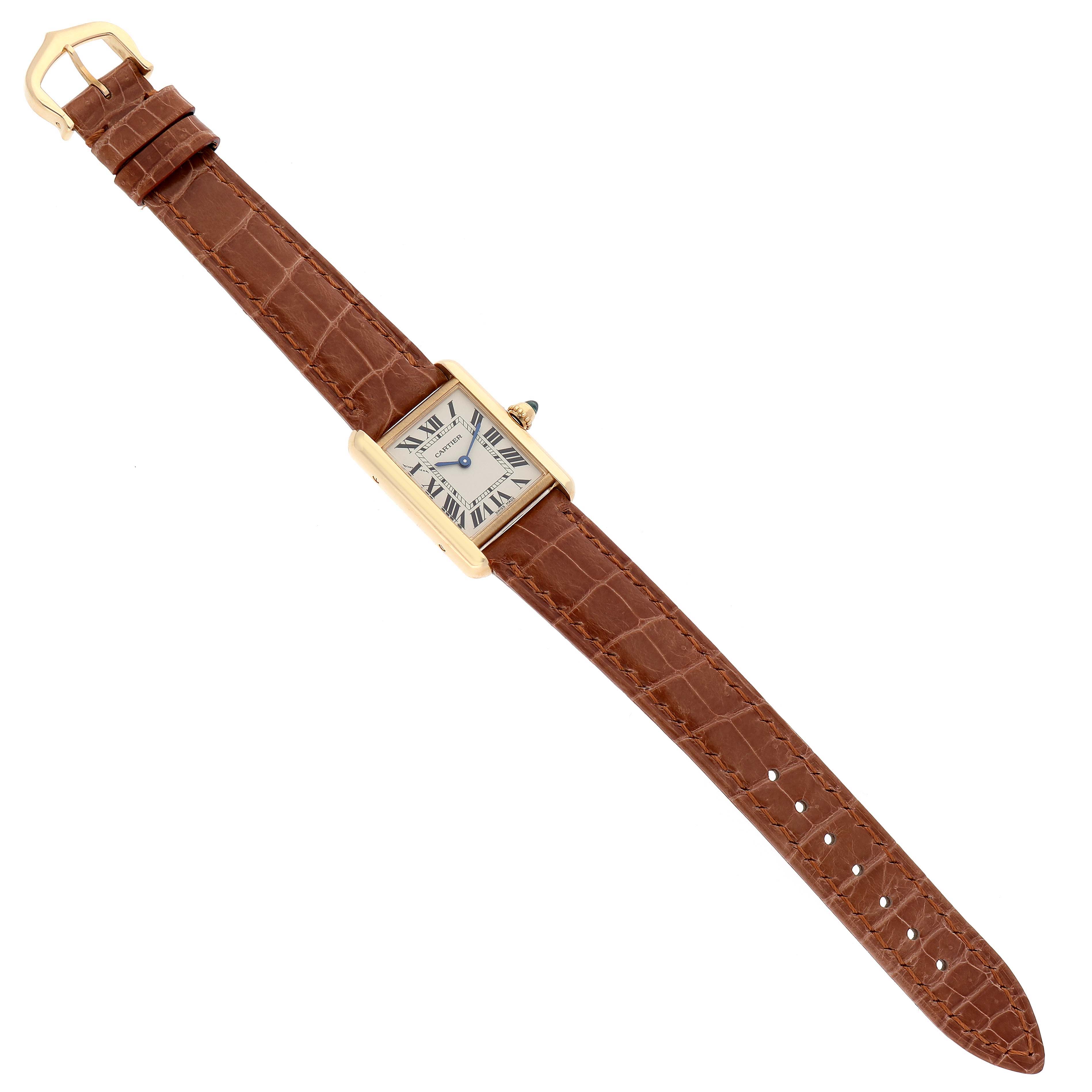 The image shows a top-down view of a Cartier Tank Louis W1529856 Women's Yellow Gold Silver Dial W1529856 Women's Yellow Gold Silver Dial watch, displaying its brown leather strap and rectangular dial.