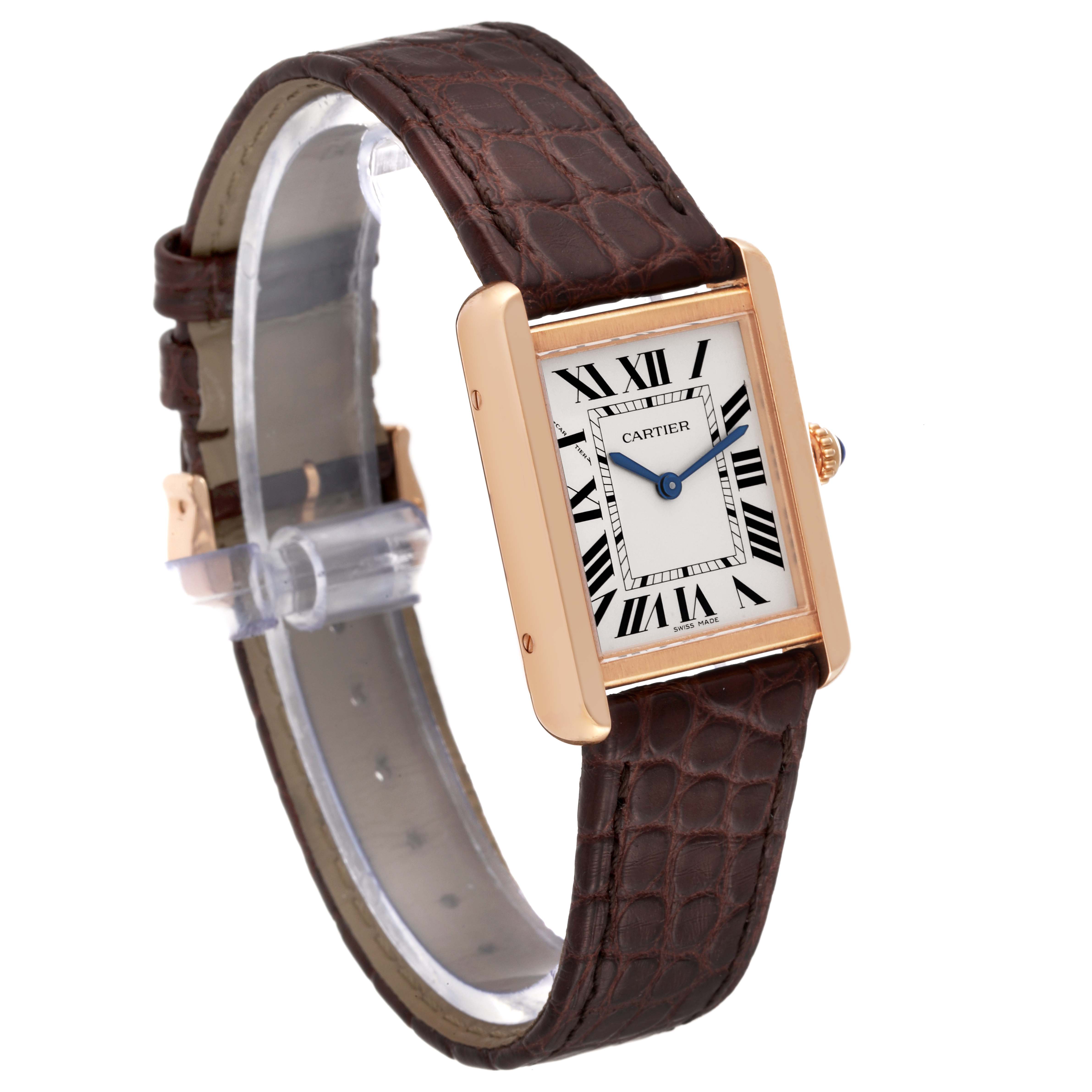 The Cartier Tank Solo W5200024 Women
s Rose Gold Silver Dial W5200024 Women
s Rose Gold Silver Dial watch is shown at a 3/4 angle, displaying its rectangular case, Roman numeral dial, and brown leather strap.