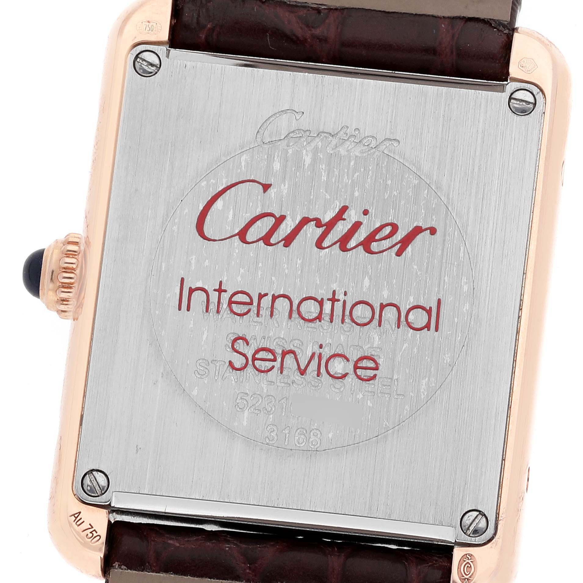 This image shows the back case and strap of the Cartier Tank Solo W5200024 Women
s Rose Gold Silver Dial W5200024 Women
s Rose Gold Silver Dial watch, featuring the brand
s logo and service information.