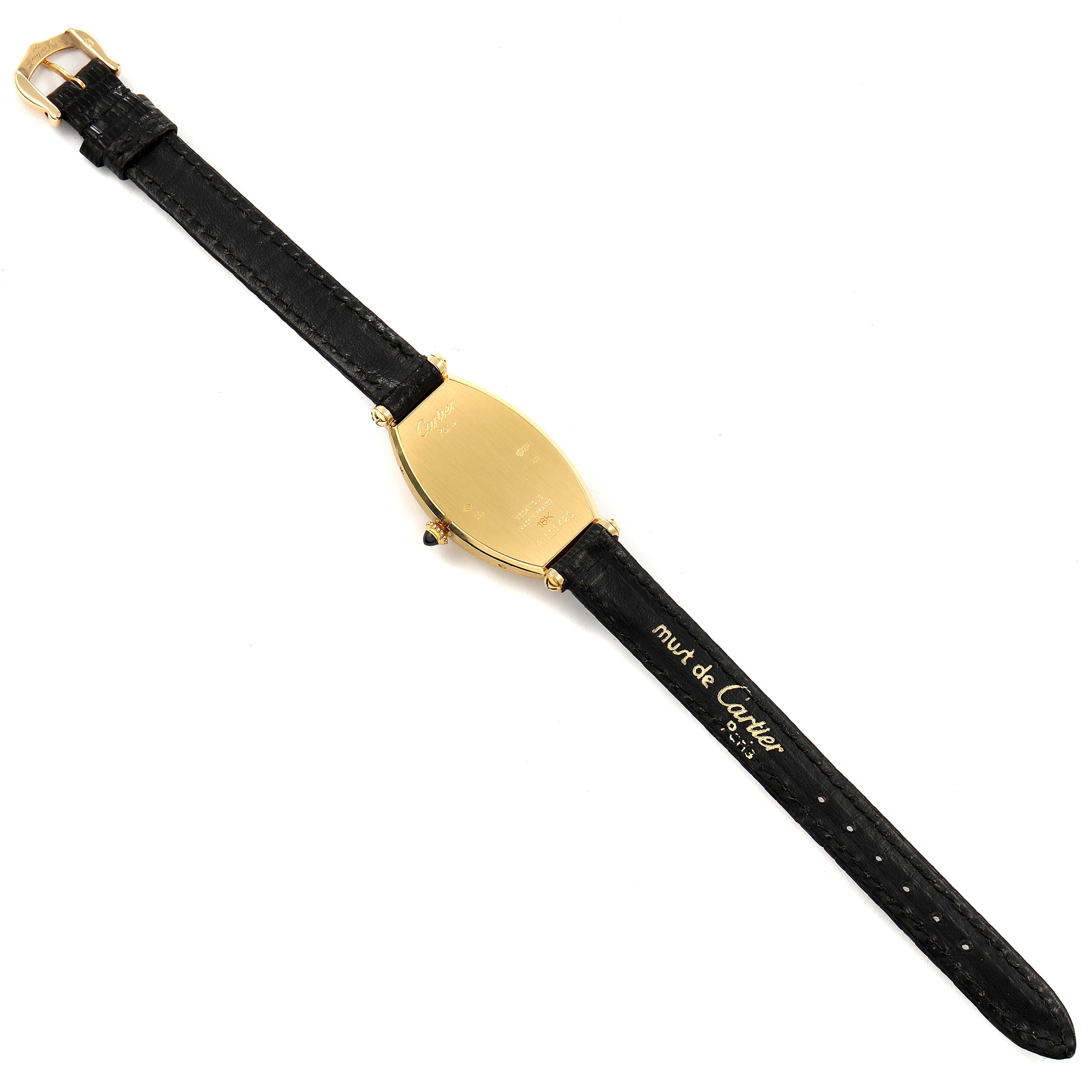 The image shows the back view of a Tortue model by Cartier, highlighting its black strap and gold-tone case.