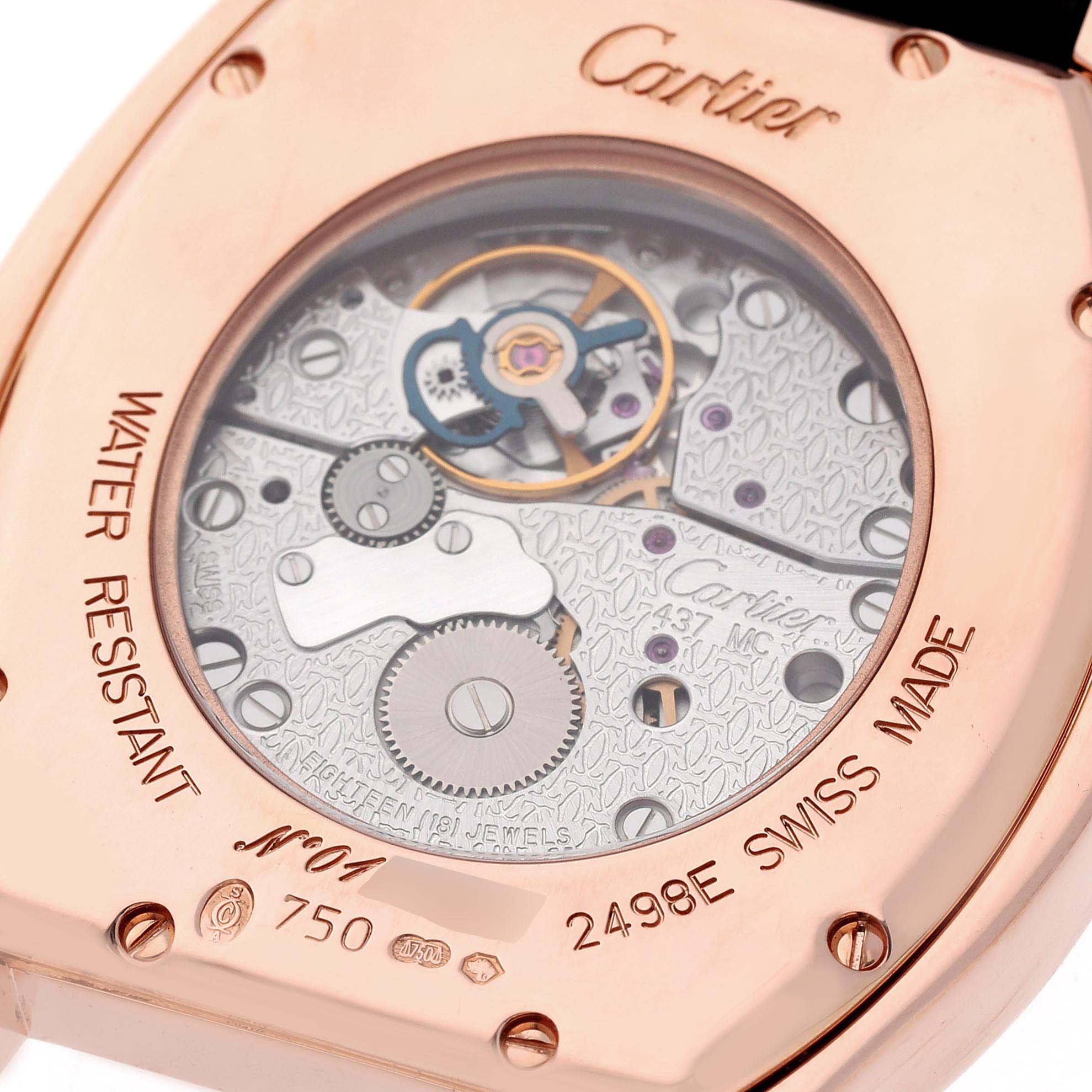 The image shows the back case of a Cartier Tortue 2498E Men's Rose Gold Silver Dial 2498E Men's Rose Gold Silver Dial watch, highlighting its movement and Swiss Made engraving.