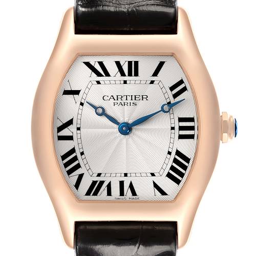 The Cartier Tortue watch is shown from the front, highlighting the dial, case, crown, and part of the strap.