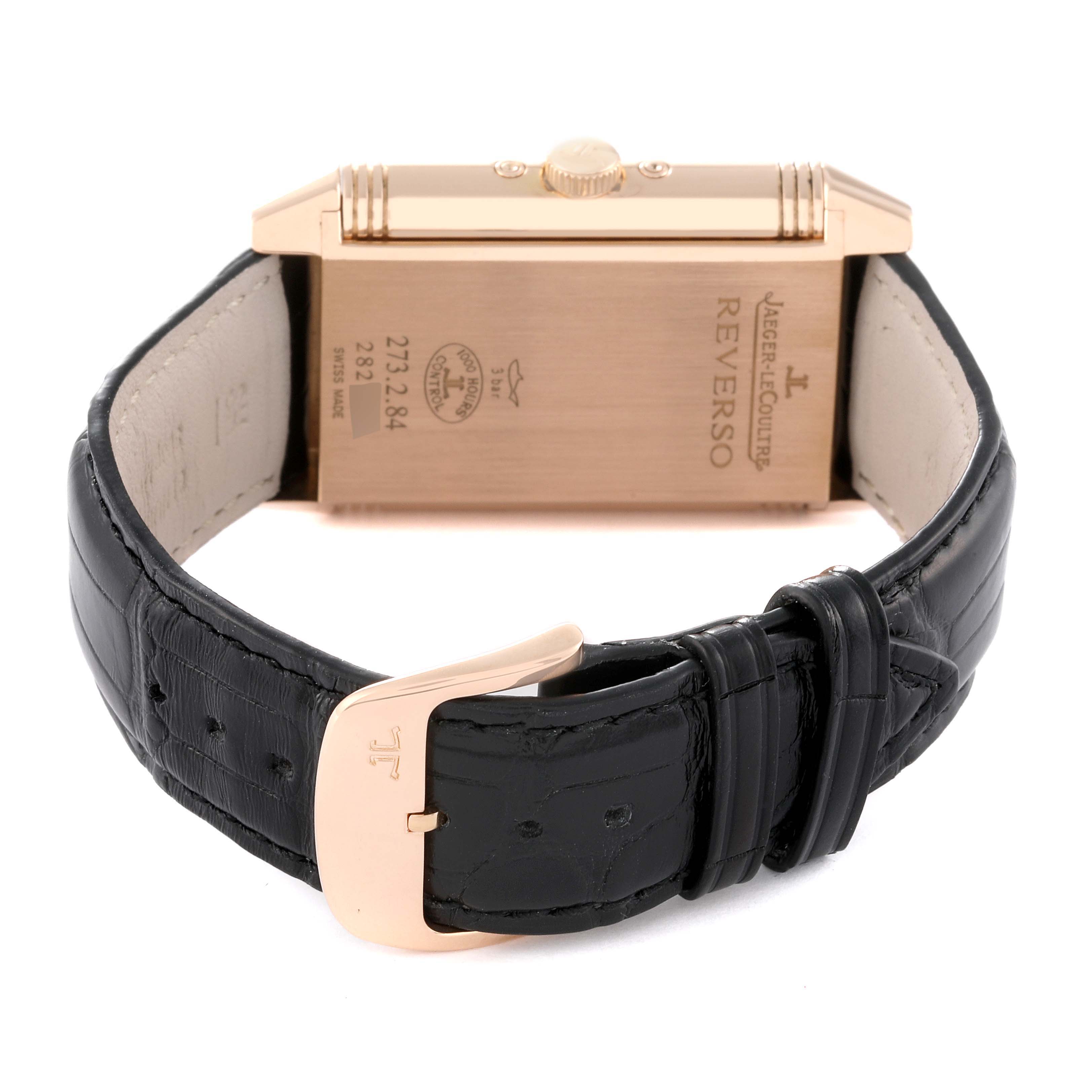 The image shows the back side of the Jaeger LeCoultre Reverso Q3752520 Men's Rose Gold Silver Dial Q3752520 Men's Rose Gold Silver Dial watch with its leather strap and buckle visible.