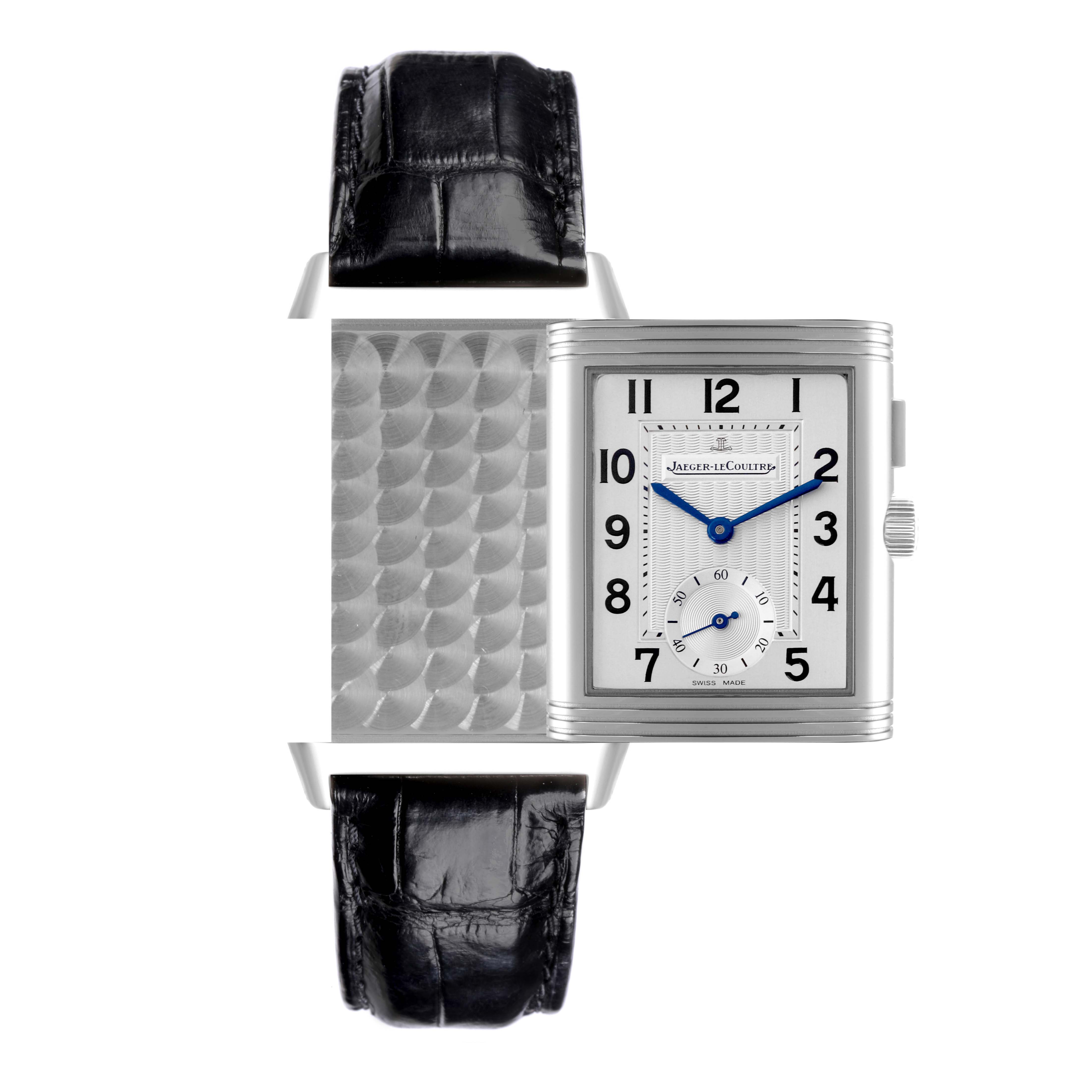 The Jaeger-LeCoultre Reverso watch is shown from the front, highlighting its face and reversible case mechanism.