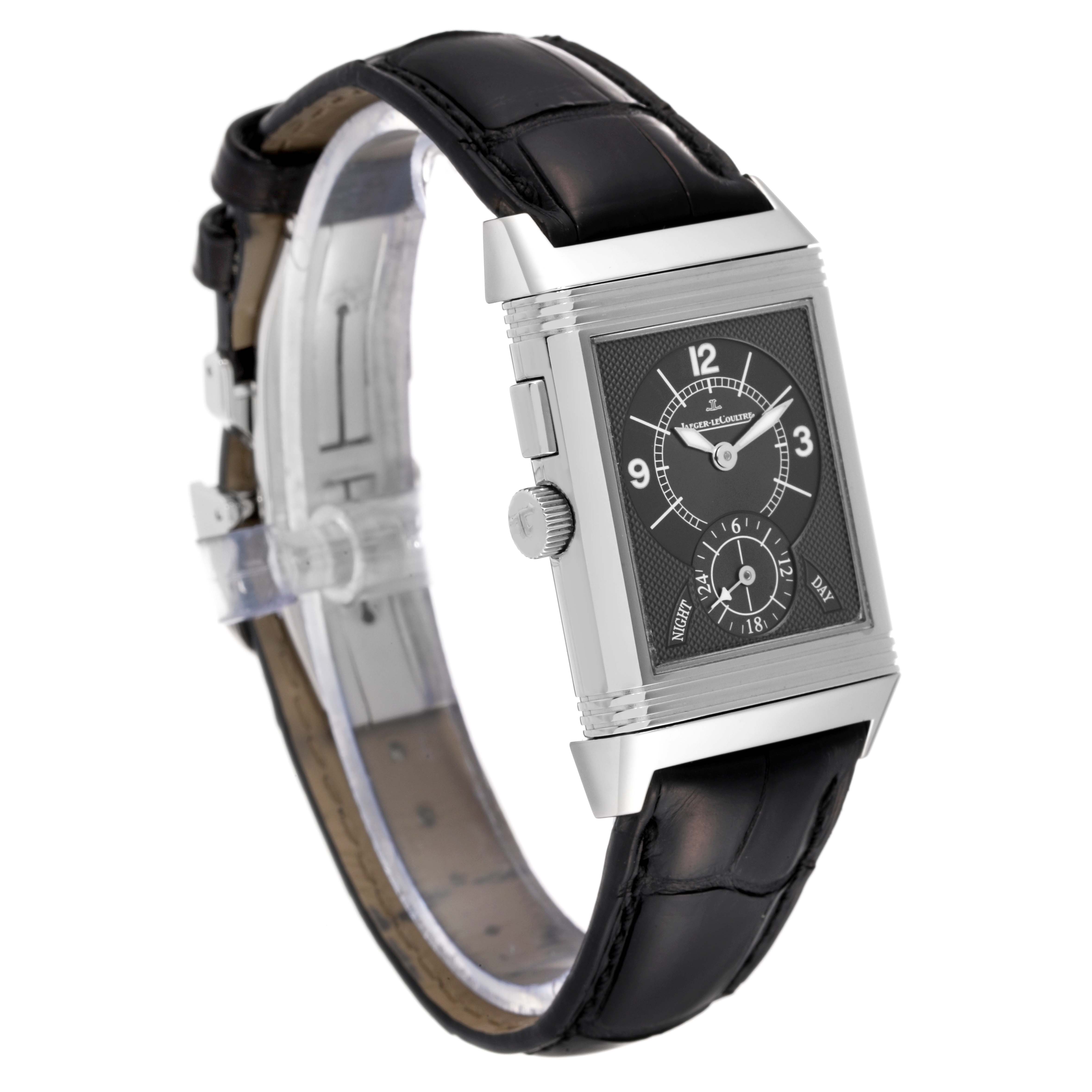 The image shows a Jaeger LeCoultre Reverso Q2718410 Men
s Stainless Steel Silver Dial Q2718410 Men
s Stainless Steel Silver Dial watch at a three-quarter angle, highlighting its rectangular face, dial, and leather strap.