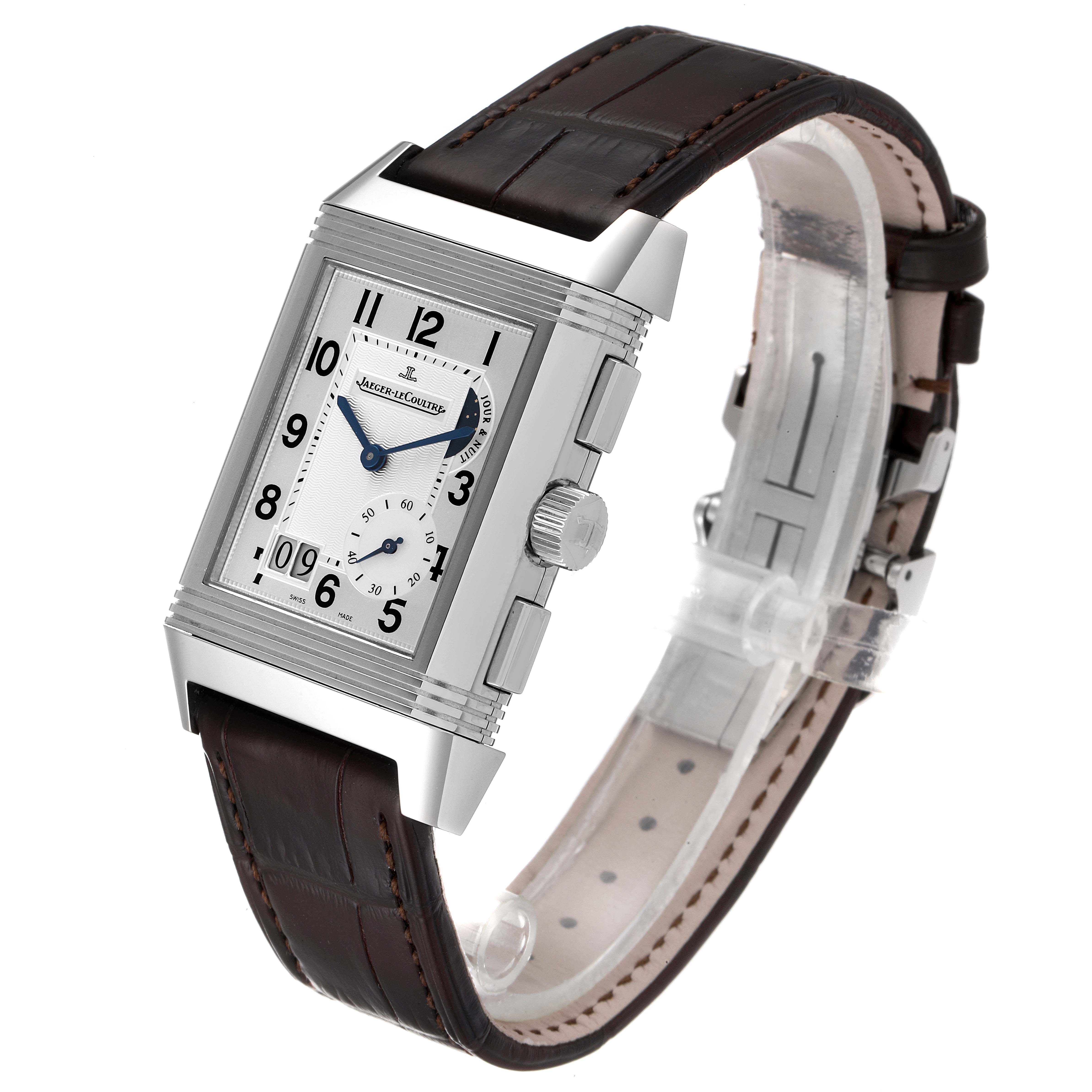 The image shows a Jaeger LeCoultre Reverso Q3028420 Men's Stainless Steel Silver Dial Q3028420 Men's Stainless Steel Silver Dial watch angled to display its rectangular dial, crown, and brown leather strap.
