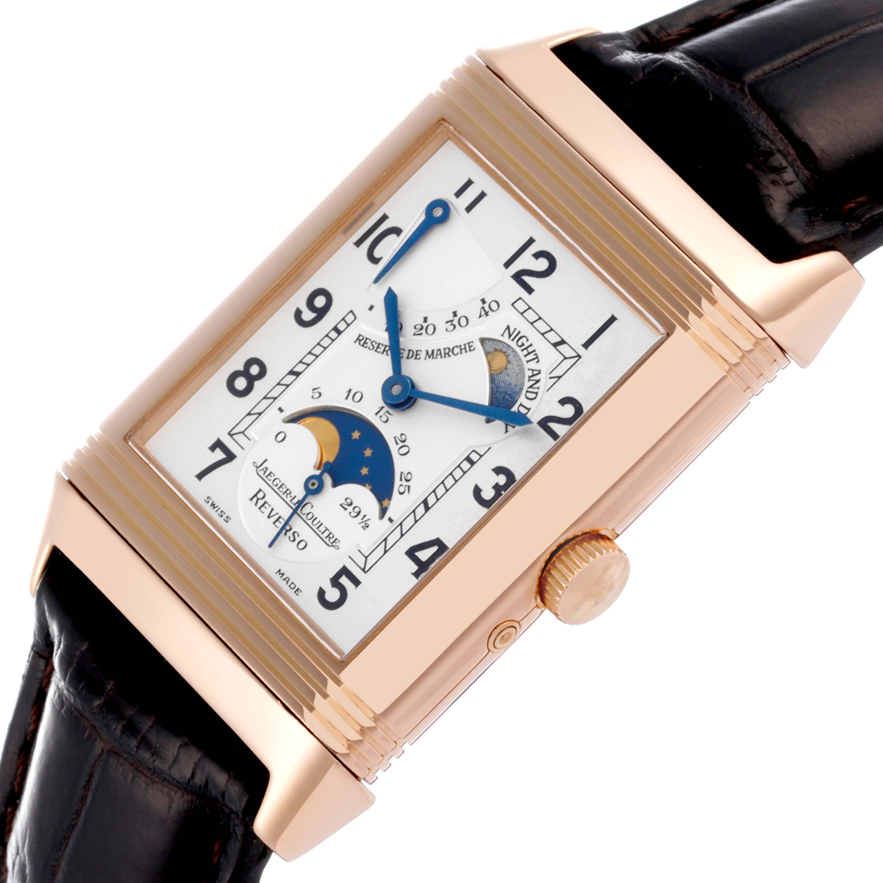 The Jaeger-LeCoultre Reverso watch is shown from a diagonal angle, highlighting its face, side crown, and leather strap.