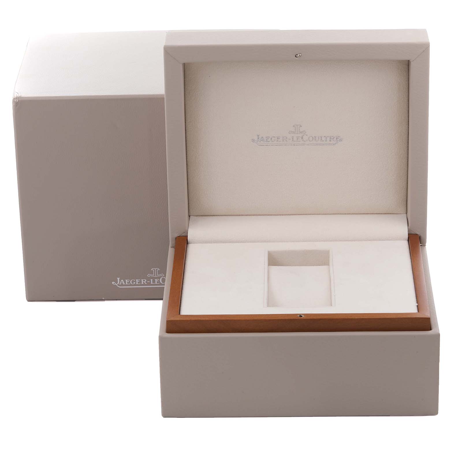 The image shows an open box for a Jaeger-LeCoultre Reverso watch, displaying the brand's logo on the interior lid.