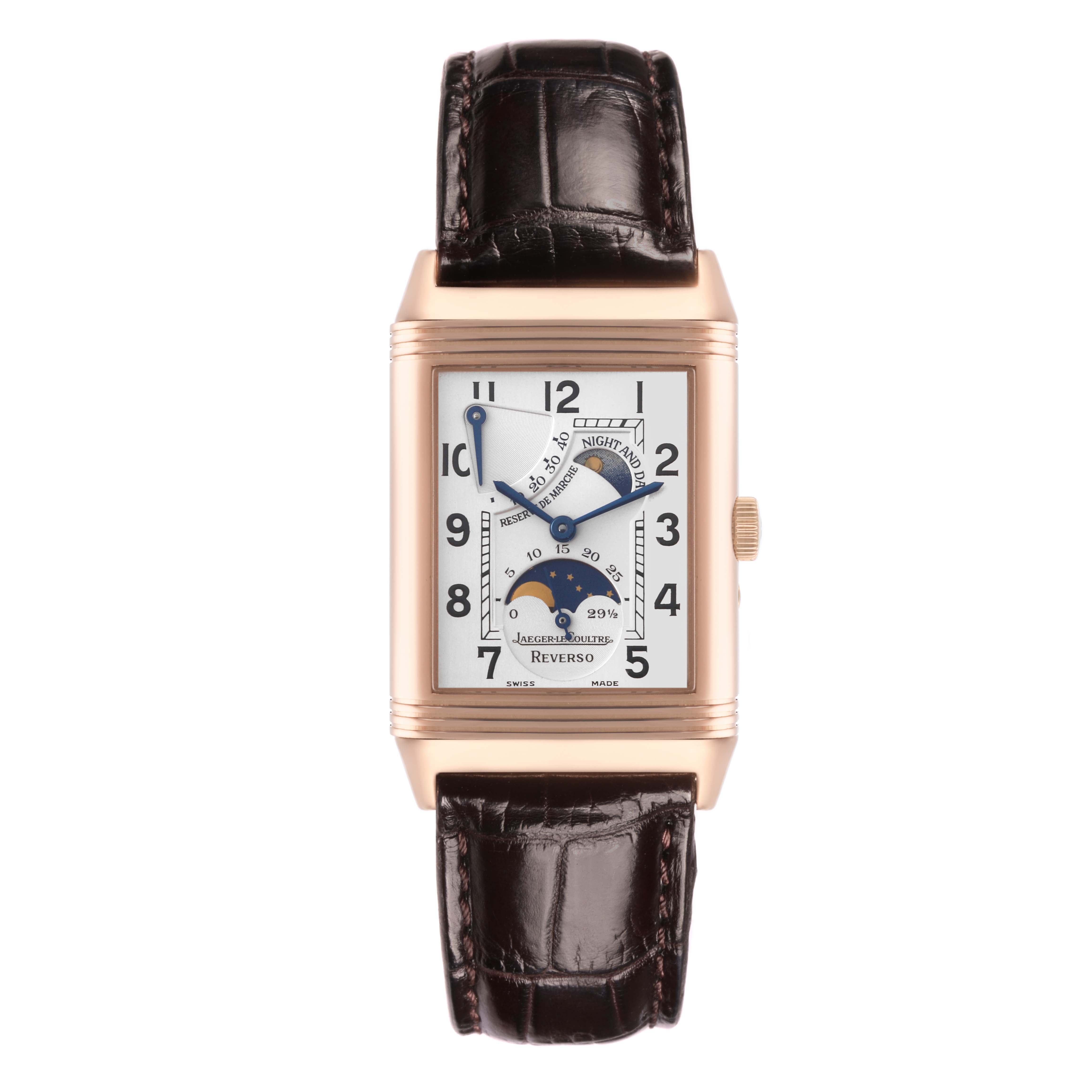 The image shows a frontal view of a Jaeger-LeCoultre Reverso watch, displaying the dial with moon phase and power reserve indicators.