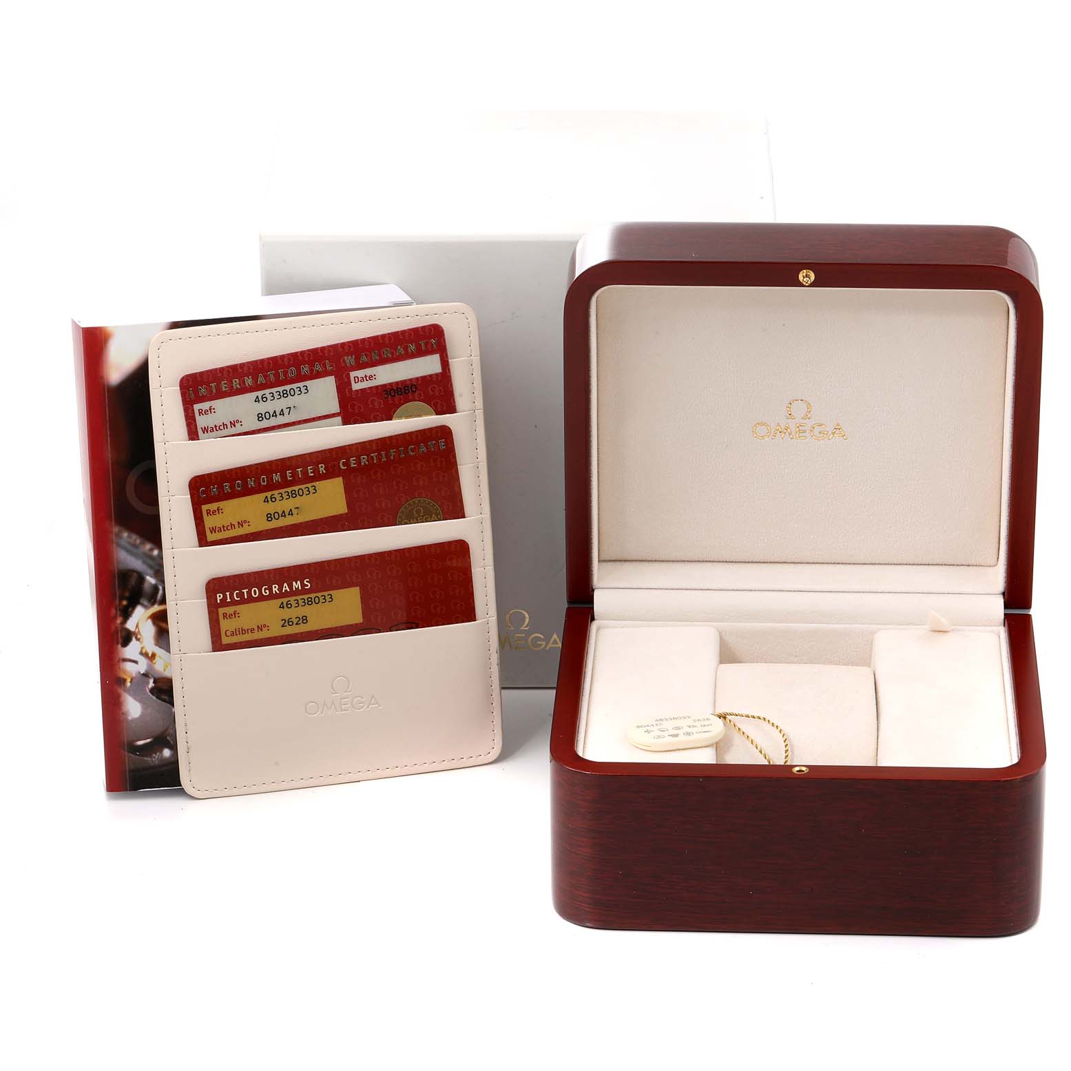 The image shows an Omega De Ville 4633.80.00 Men's Yellow Gold Blue Dial 4633.80.00 Men's Yellow Gold Blue Dial watch's open wooden box, warranty cards, and booklet from a frontal angle.