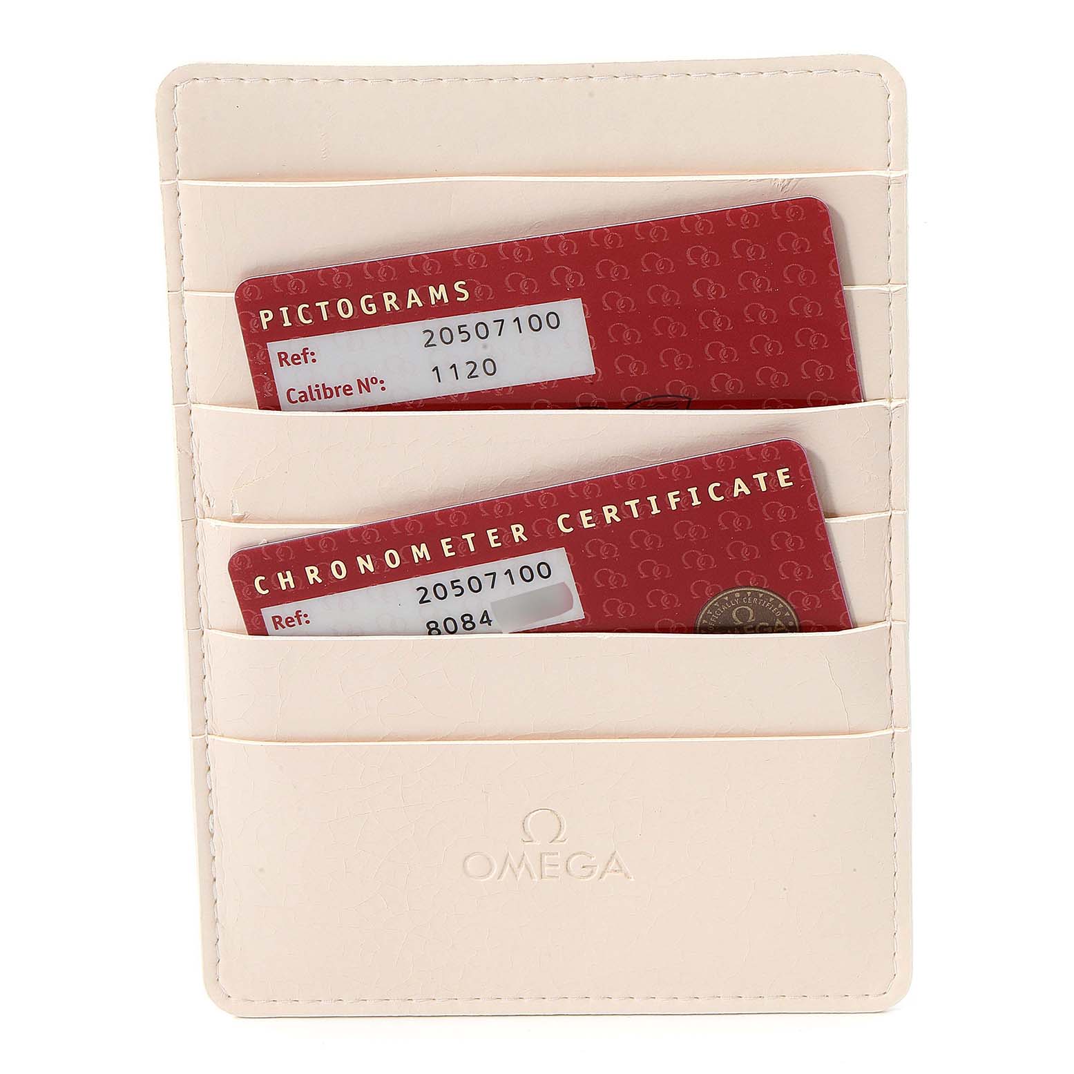 This image shows a beige Omega cardholder containing red warranty cards for the Seamaster model by Omega.