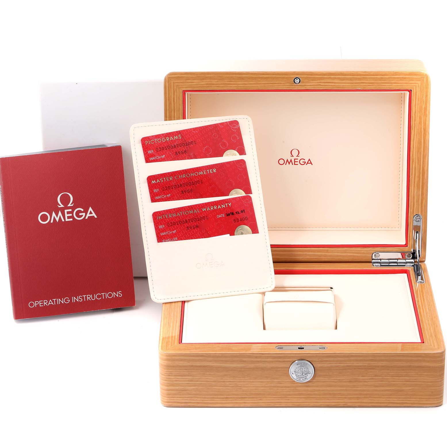 The image shows the packaging, warranty cards, and operating instructions for the Omega Aqua Terra 220.10.38.20.01.001 Men's Stainless Steel Black Dial 220.10.38.20.01.001 Men's Stainless Steel Black Dial watch.