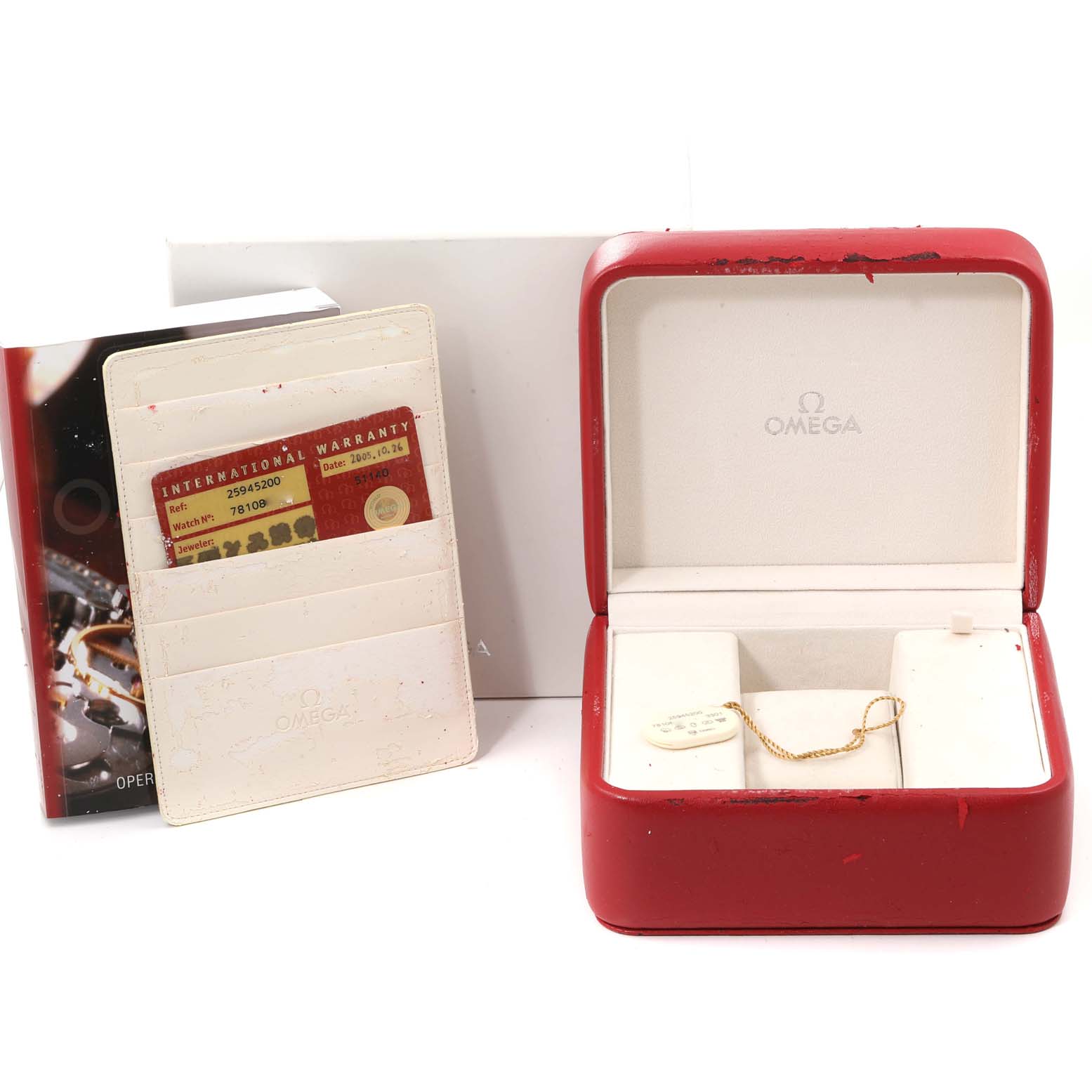 The image shows the box, international warranty cardholder, and paperwork for an Omega Seamaster 2594.52.00 Men's Stainless Steel Black Dial 2594.52.00 Men's Stainless Steel Black Dial watch.