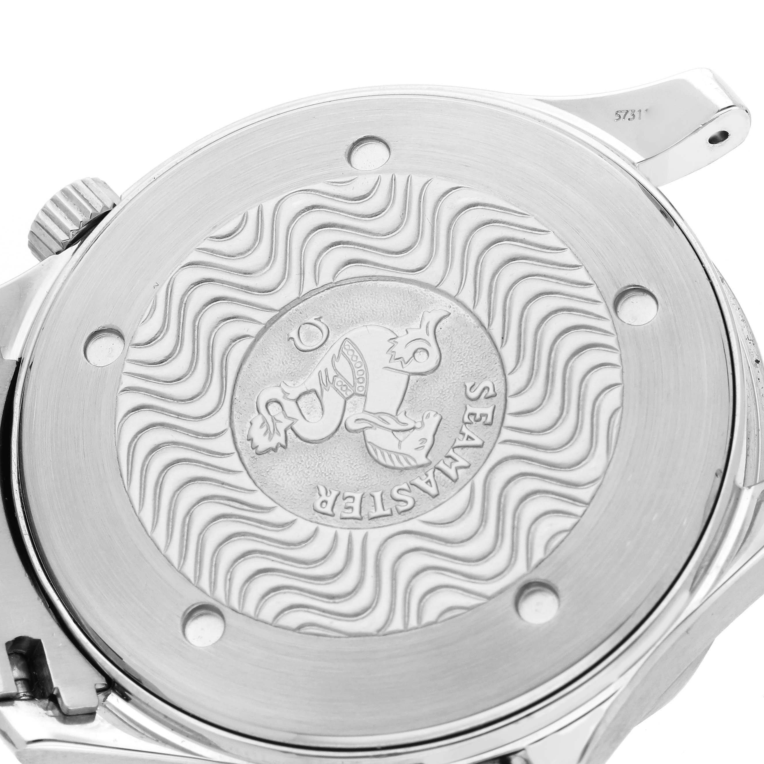 The image shows the back case of an Omega Seamaster 2265.80.00 Men
s Stainless Steel Blue Dial 2265.80.00 Men
s Stainless Steel Blue Dial watch with the brand
s emblem and wavy pattern.