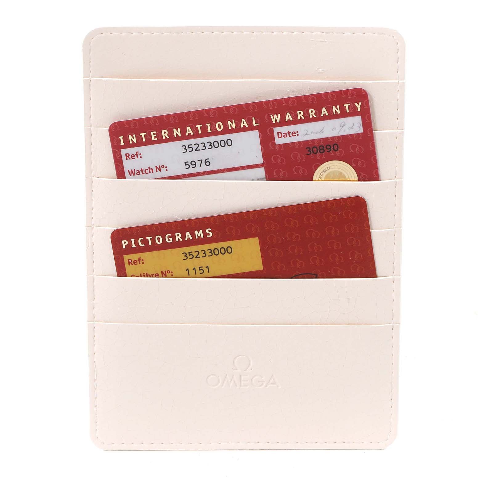 The image shows a white Omega cardholder containing International Warranty and Pictograms cards for an Omega Speedmaster 3523.30.00 Men
s Stainless Steel Silver Dial 3523.30.00 Men
s Stainless Steel Silver Dial watch.