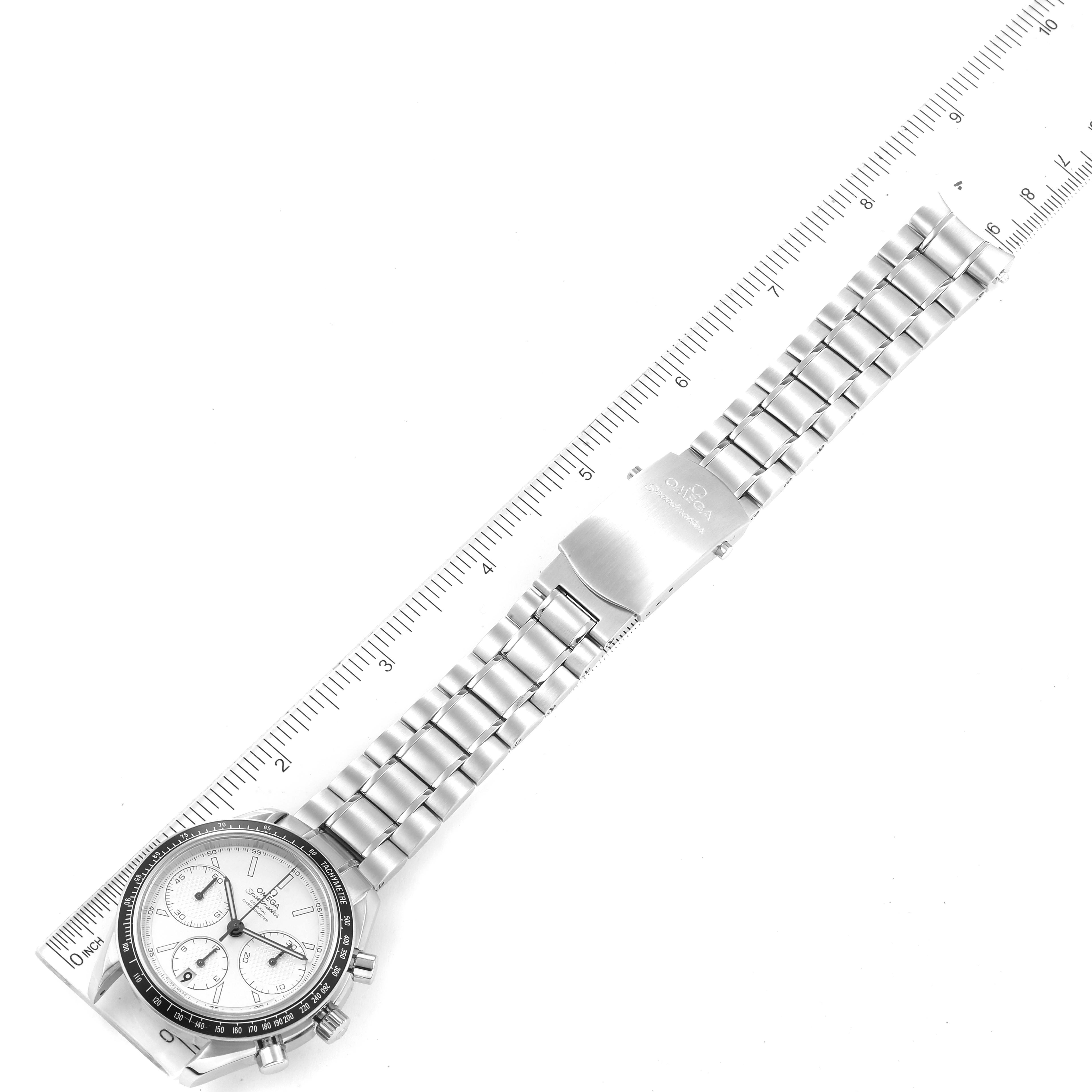 The image shows the Omega Speedmaster 326.30.40.50.02.001 Men's Stainless Steel Silver Dial 326.30.40.50.02.001 Men's Stainless Steel Silver Dial watch laid flat with its stainless steel strap, clasp, and stopwatch face visible, alongside a ruler for scale.