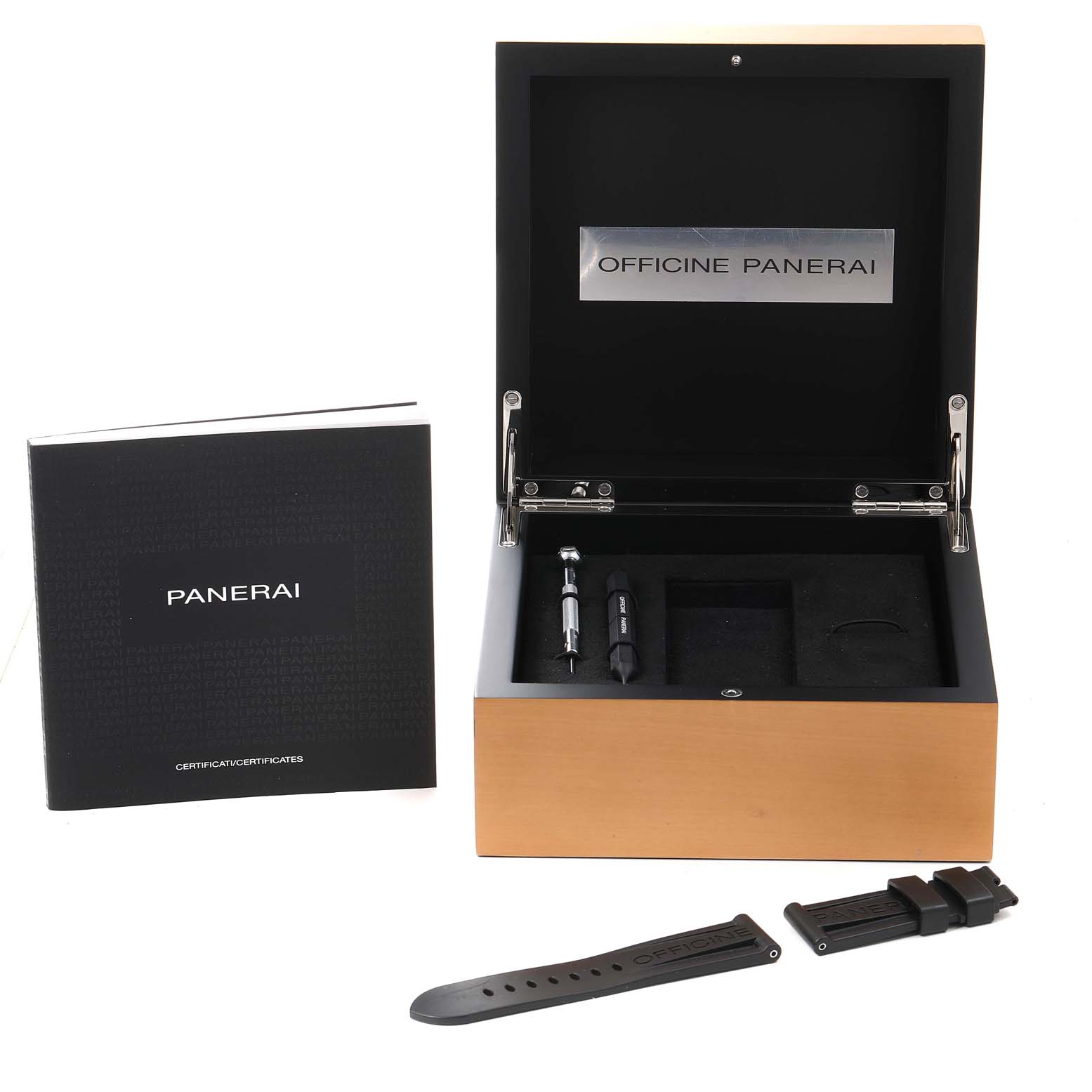 The image shows the packaging and accessories of a Panerai Luminor PAM01321 Men
s Stainless Steel Black Dial PAM01321 Men
s Stainless Steel Black Dial watch, including a box, booklet, screwdriver, and an extra strap.