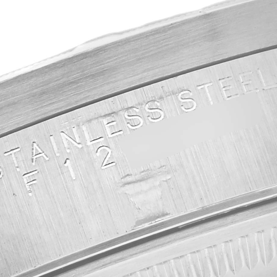 The image shows a close-up of the stainless steel back of a Rolex Air-King 14010 Men's Stainless Steel Black Dial 14010 Men's Stainless Steel Black Dial watch, highlighting engravings.