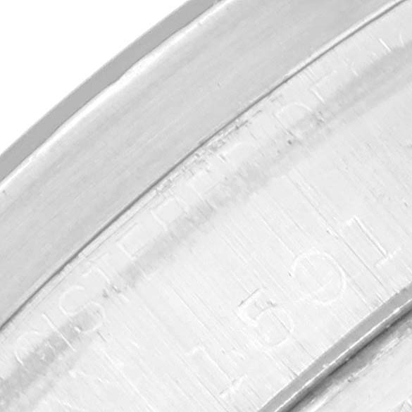 The image shows a close-up view of the outer edge, likely the bezel or case, of a Rolex Vintage Collection 1501 Men's Stainless Steel Blue Dial 1501 Men's Stainless Steel Blue Dial watch.