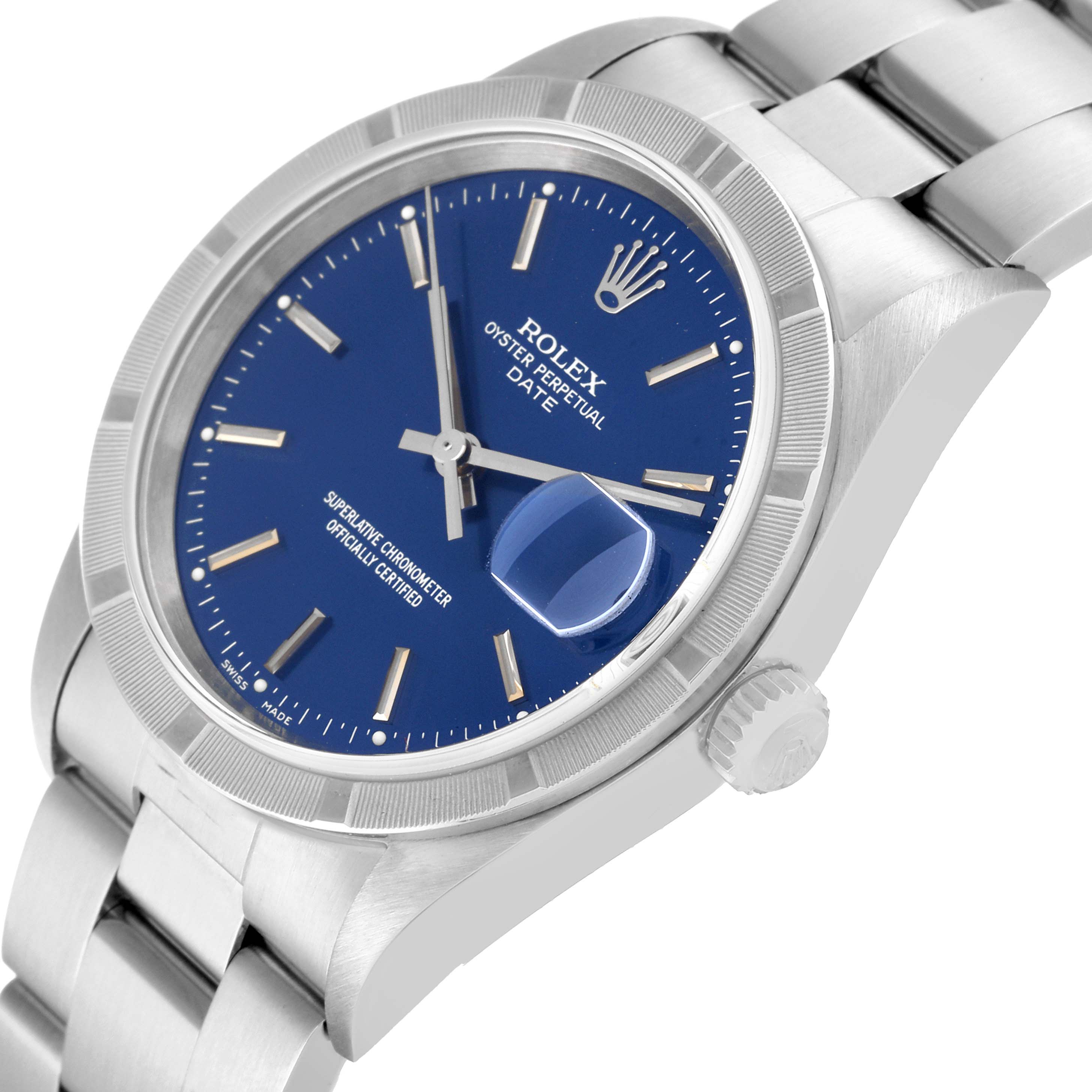The image shows a side angle close-up of a Rolex Date 15210 Men's Stainless Steel Blue Dial 15210 Men's Stainless Steel Blue Dial model watch, highlighting the blue dial, crown, and bracelet.