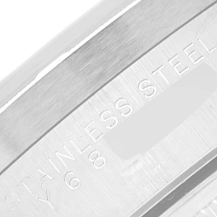This image shows a close-up of the inner bracelet of a Rolex Date 15210 Men's Stainless Steel Blue Dial 15210 Men's Stainless Steel Blue Dial model watch, inscribed with "STAINLESS STEEL."