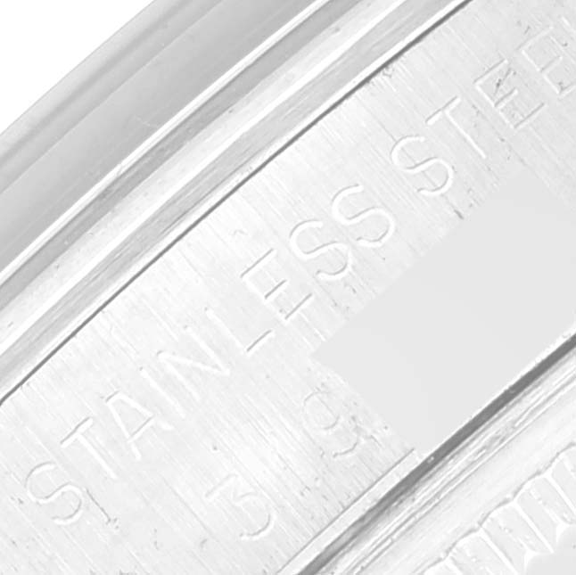 This close-up image shows the engraved stainless steel section of a Vintage Collection Rolex watch.