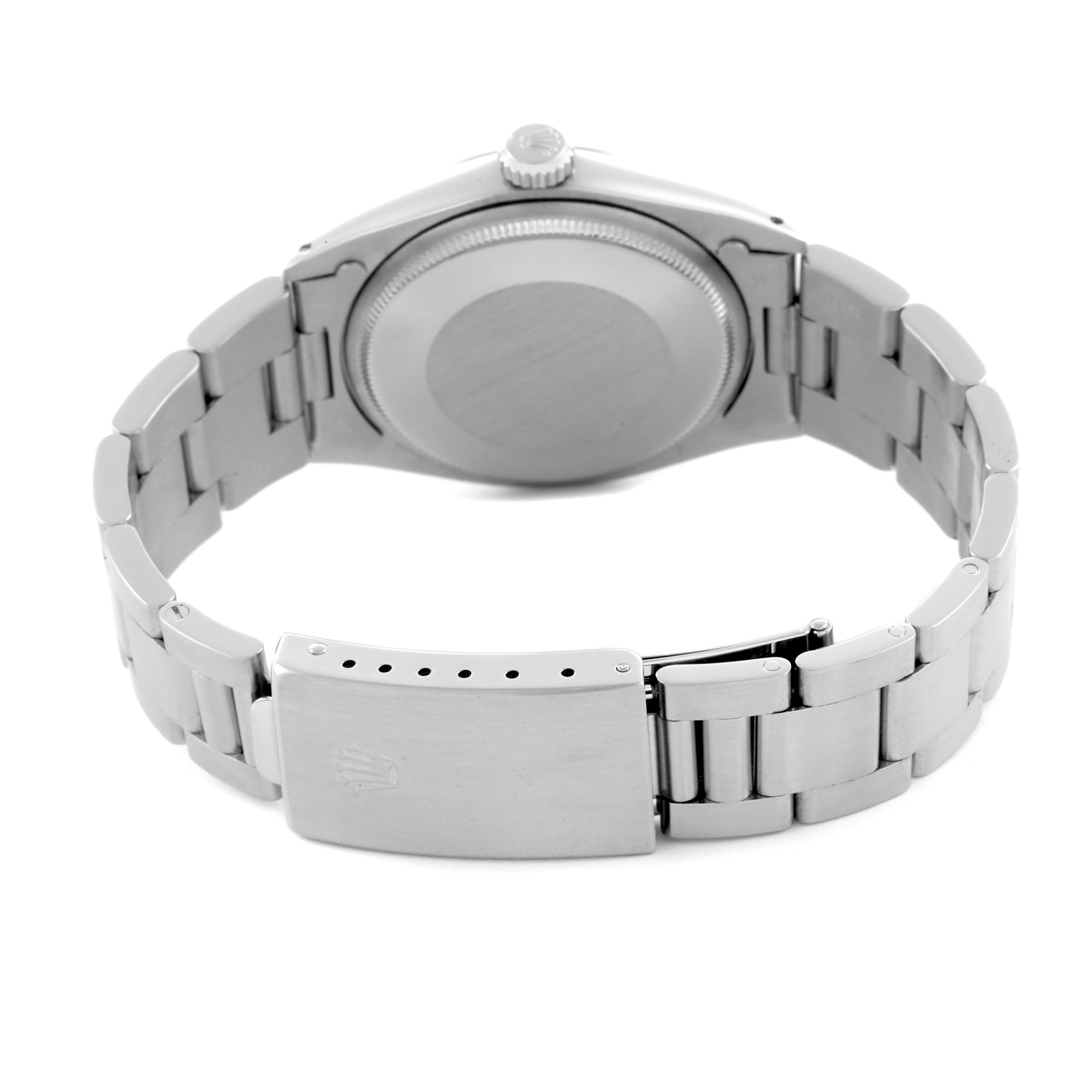 The Vintage Collection model by Rolex is shown from the back, highlighting the case back, crown, and bracelet clasp.