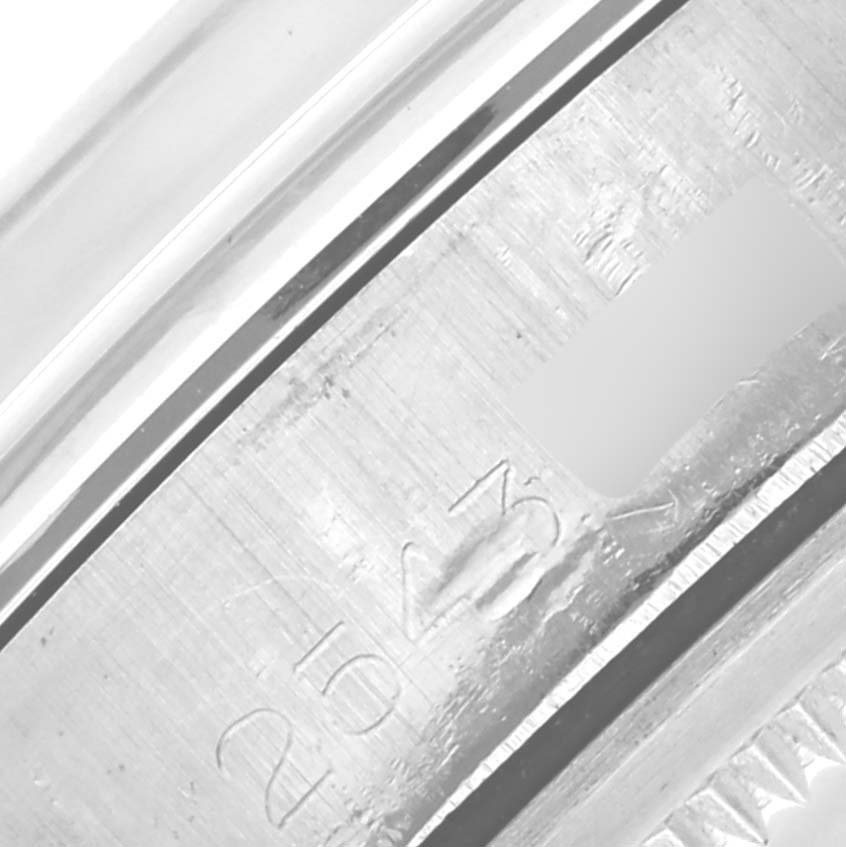 The image shows a close-up of the inner bezel with serial engravings of a Rolex Vintage Collection 1500 Men's Stainless Steel Blue Dial 1500 Men's Stainless Steel Blue Dial model.